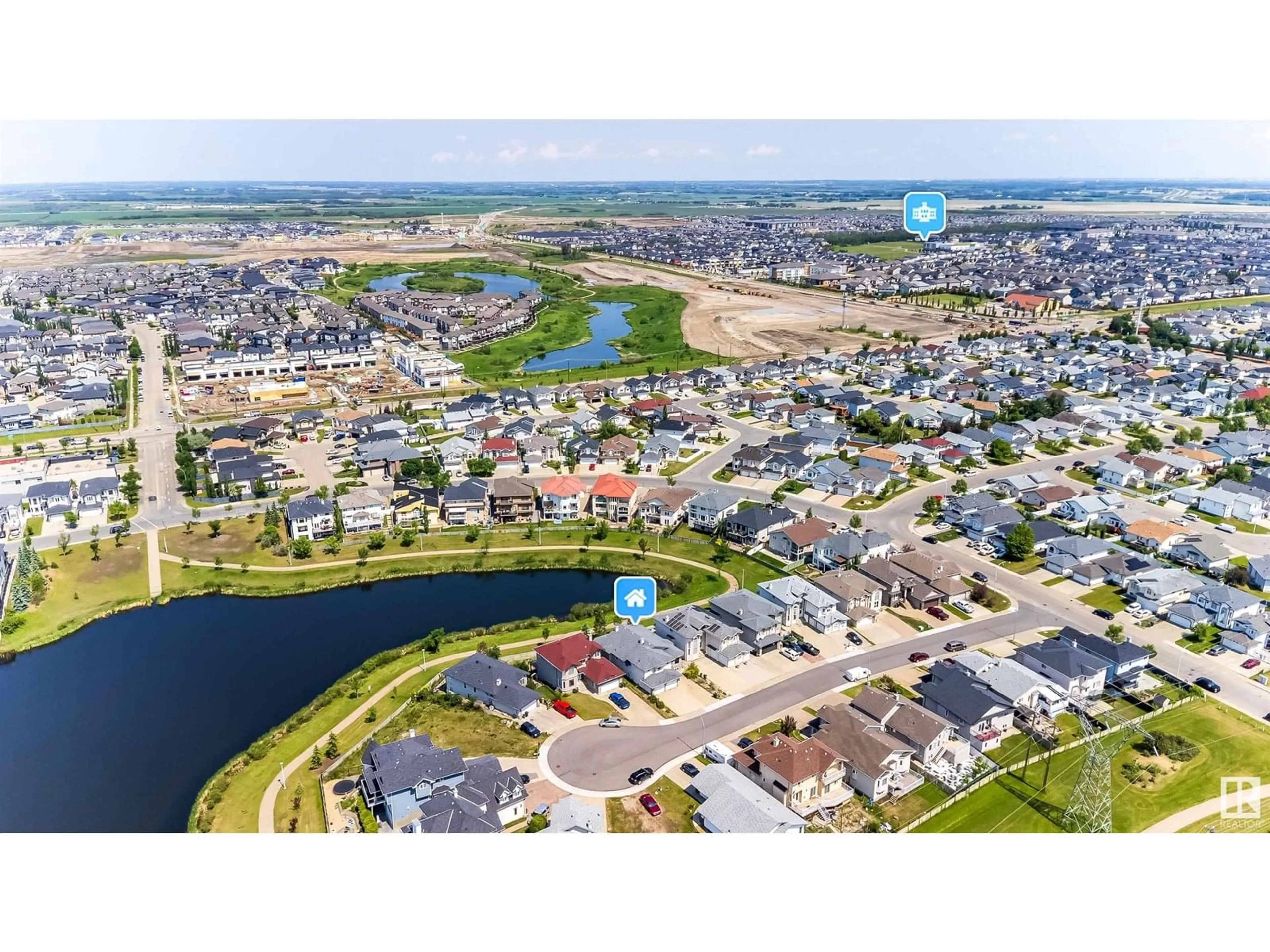 A pic from outside/outdoor area/front of a property/back of a property/a pic from drone, water/lake/river/ocean view for 6928 164 AV, Edmonton Alberta T5Z3R3