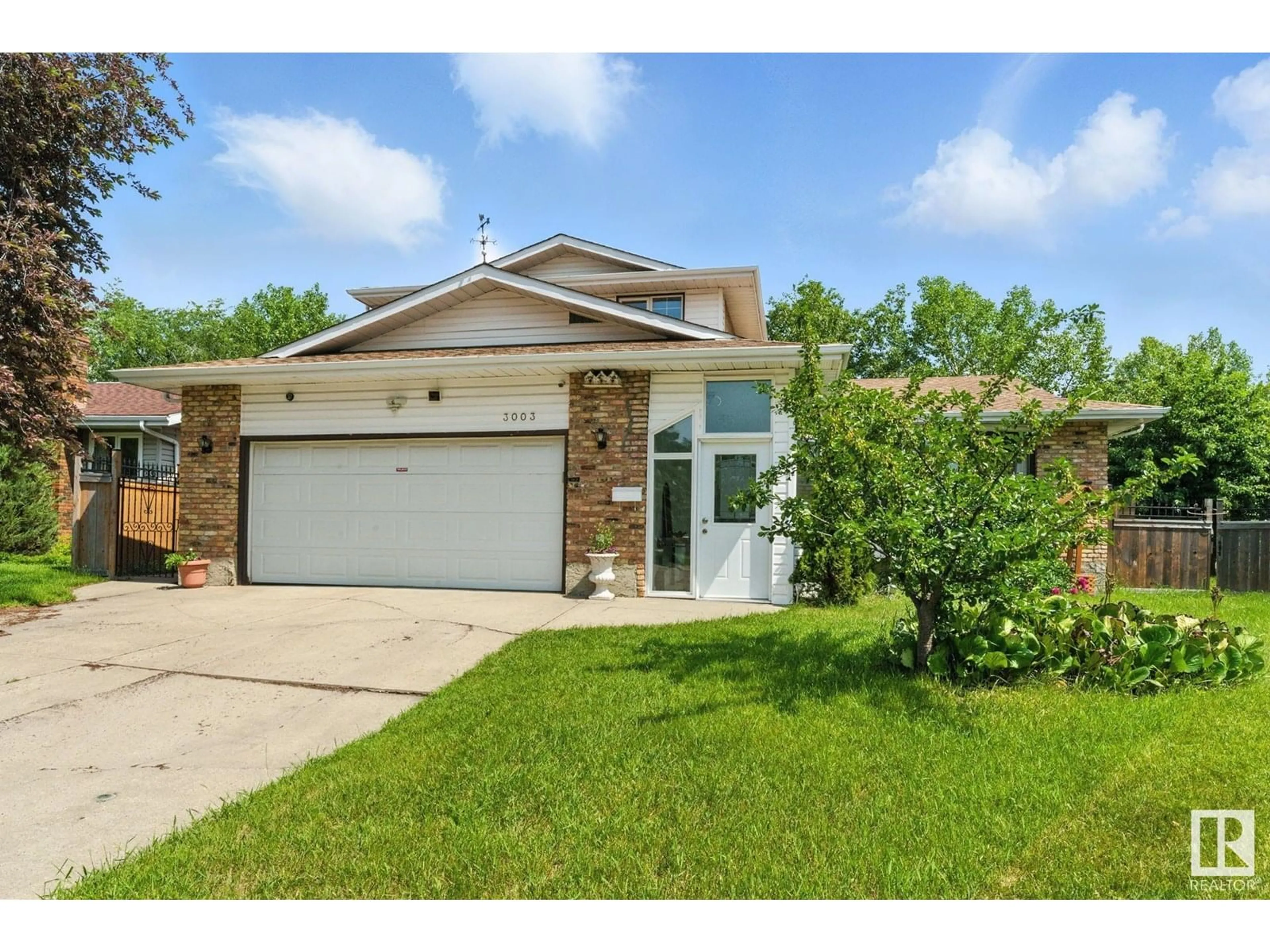 Home with brick exterior material, street for NW - 3003 105 ST, Edmonton Alberta T6J2Z7