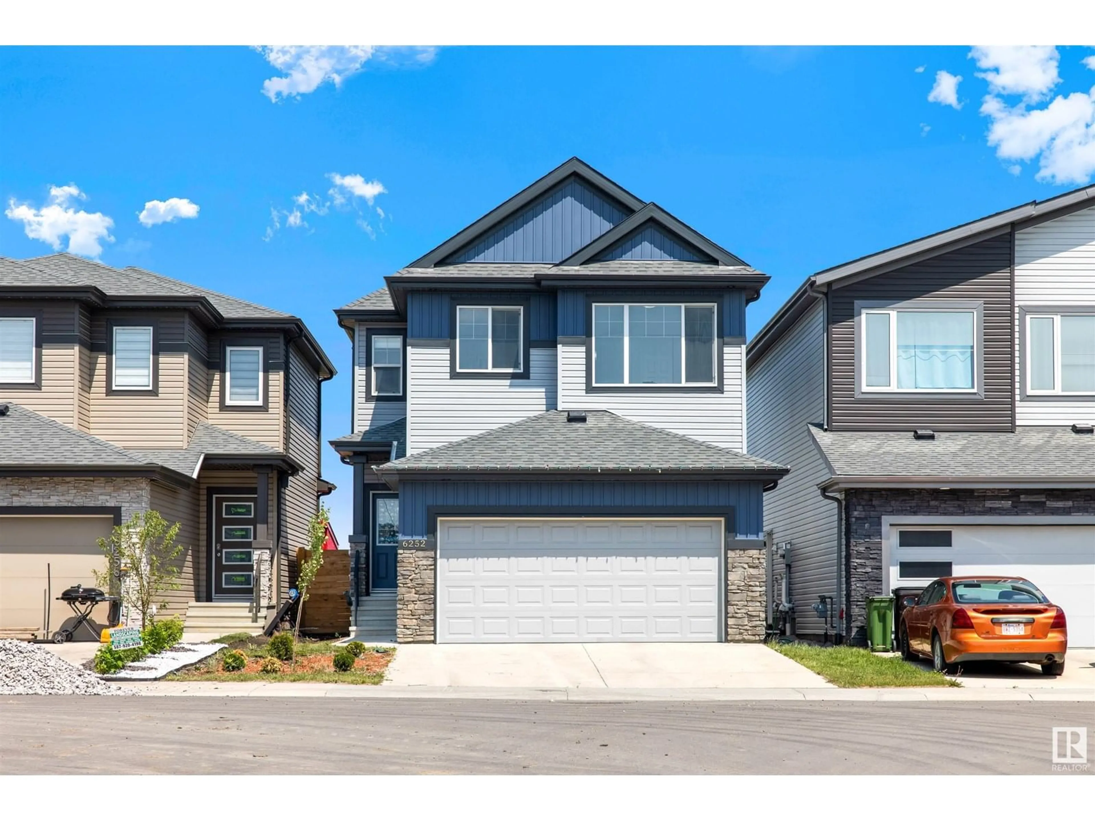 Home with vinyl exterior material, street for 6252 180 AV, Edmonton Alberta T5Y4A6