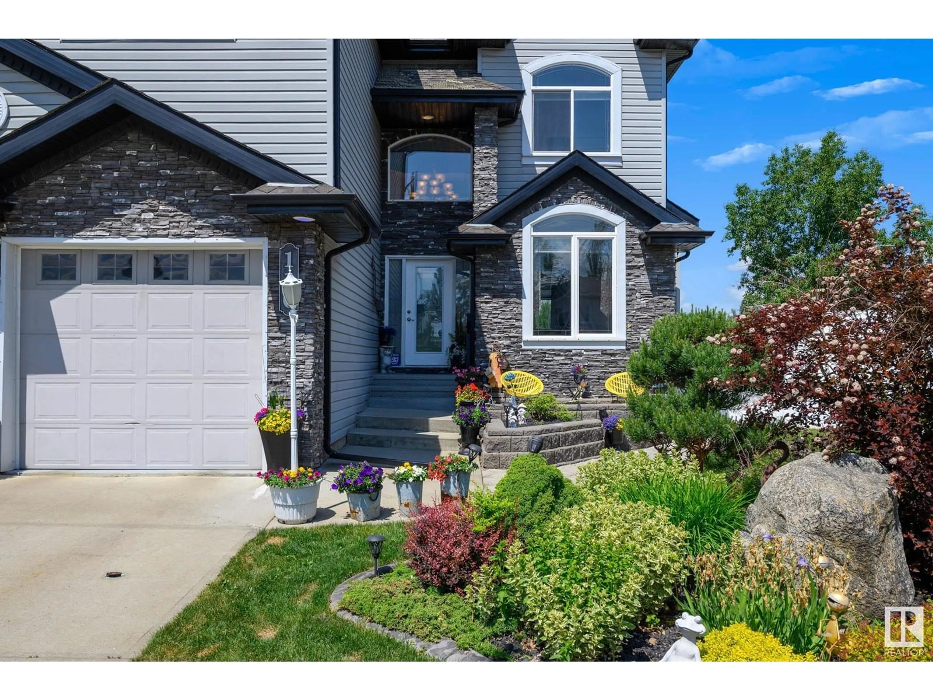 Home with vinyl exterior material, street for 110 RUE MARSEILLE, Beaumont Alberta T4X1W1