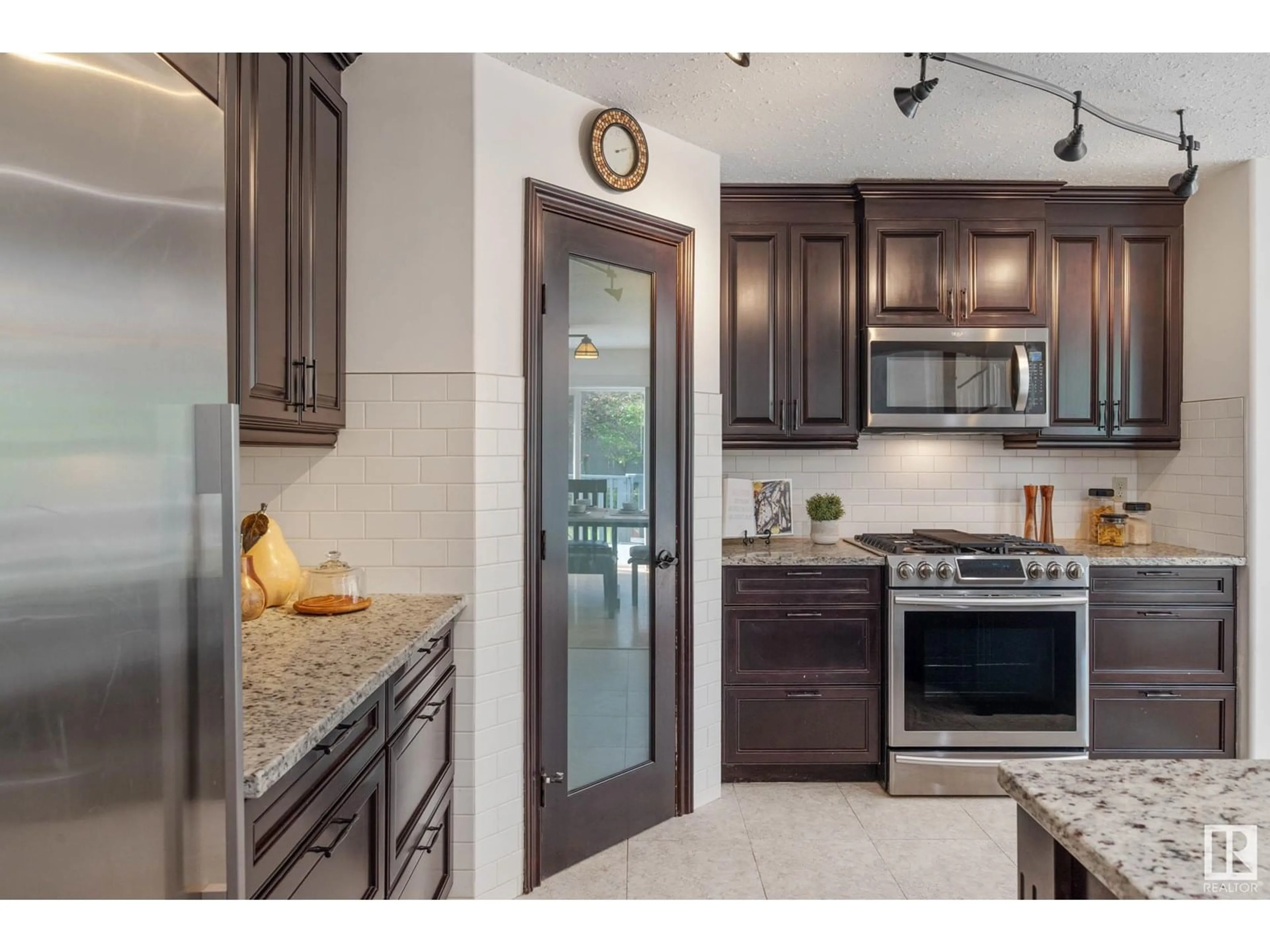 Open concept kitchen, ceramic/tile floor for 4319 38A AV, Edmonton Alberta T6L6Z5