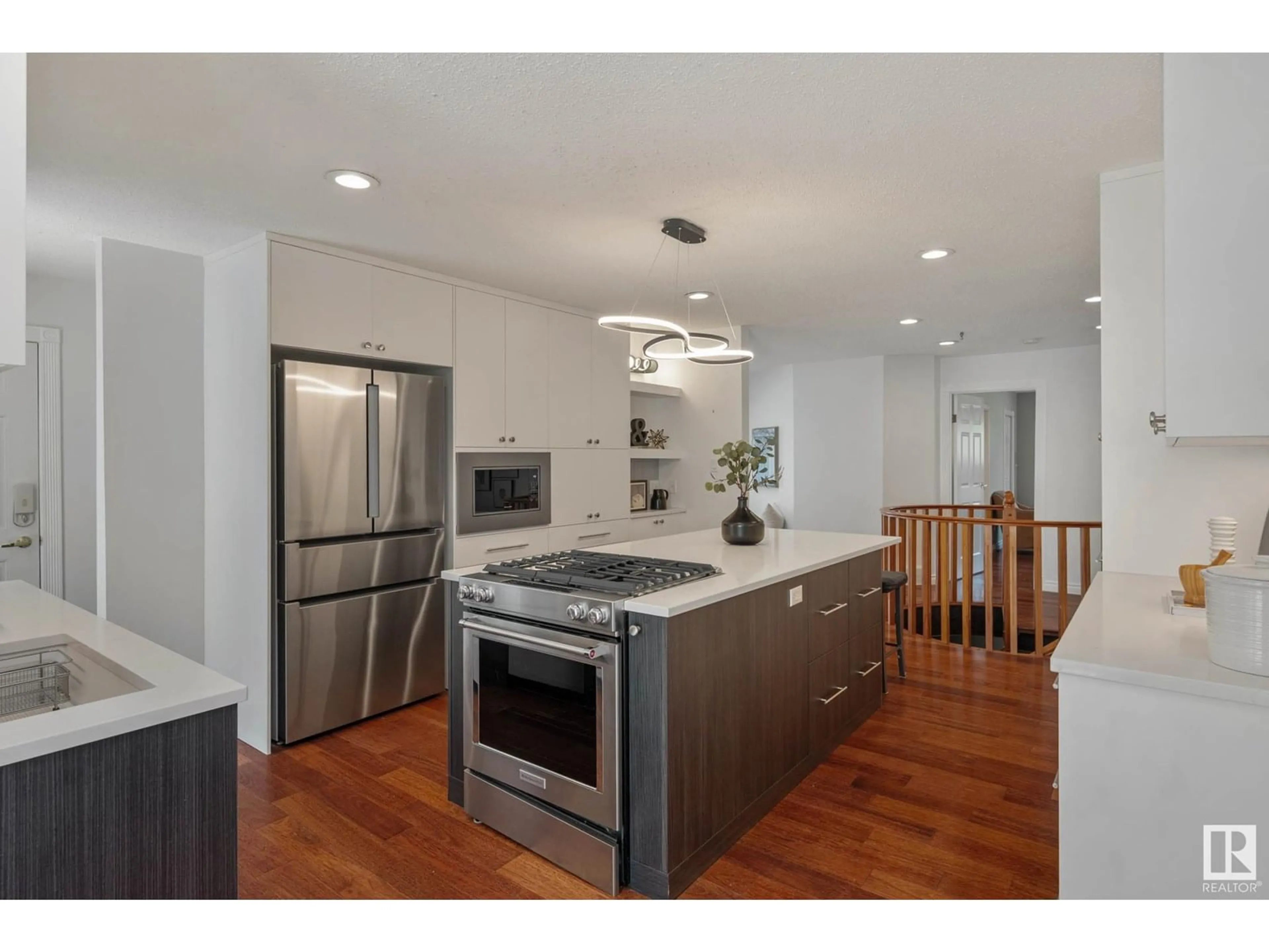 Open concept kitchen, wood/laminate floor for 15713 111 ST, Edmonton Alberta T5X4S3