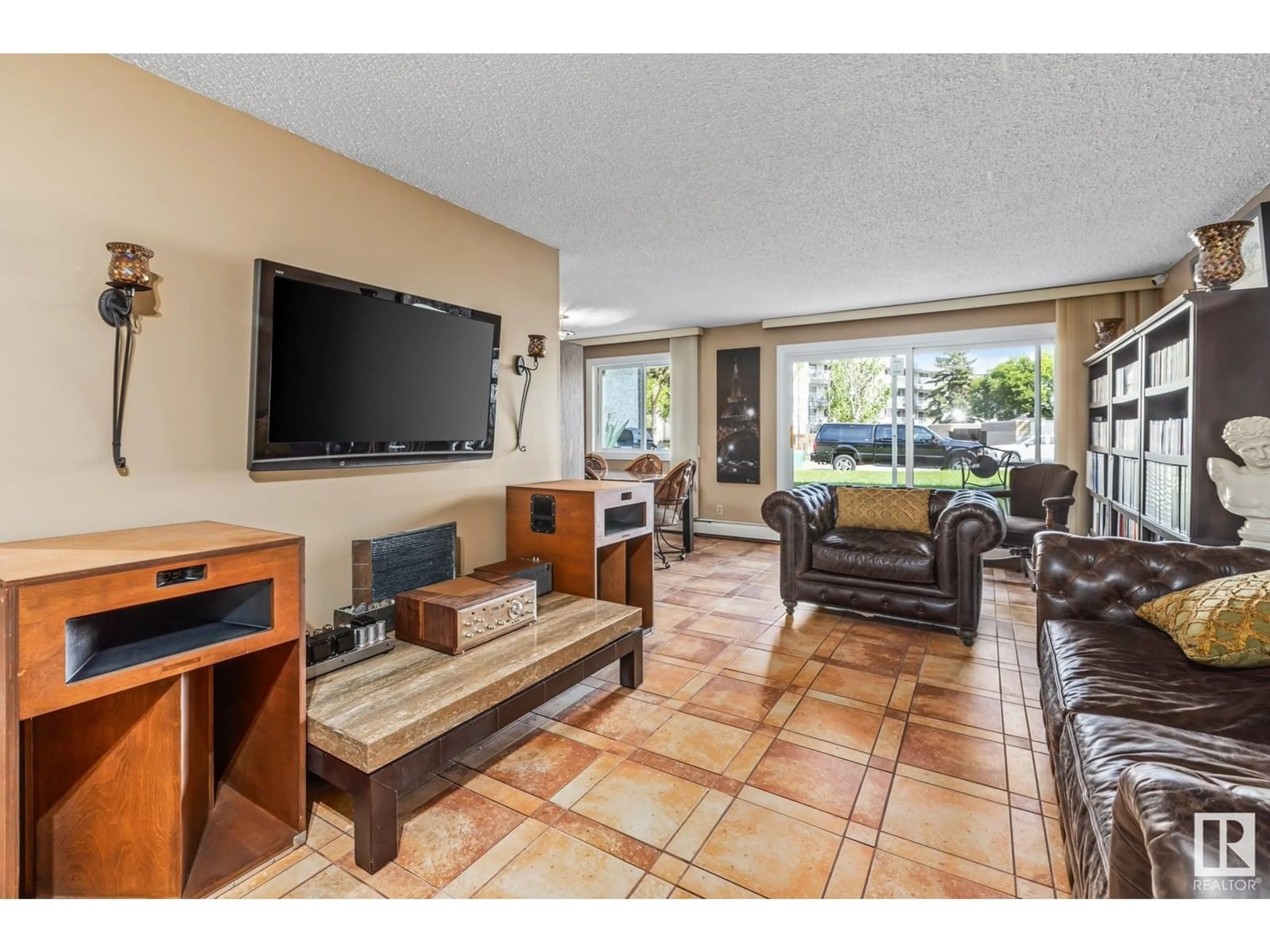 Living room with furniture, ceramic/tile floor for #101 - 14825 51 AV, Edmonton Alberta T6H5G4