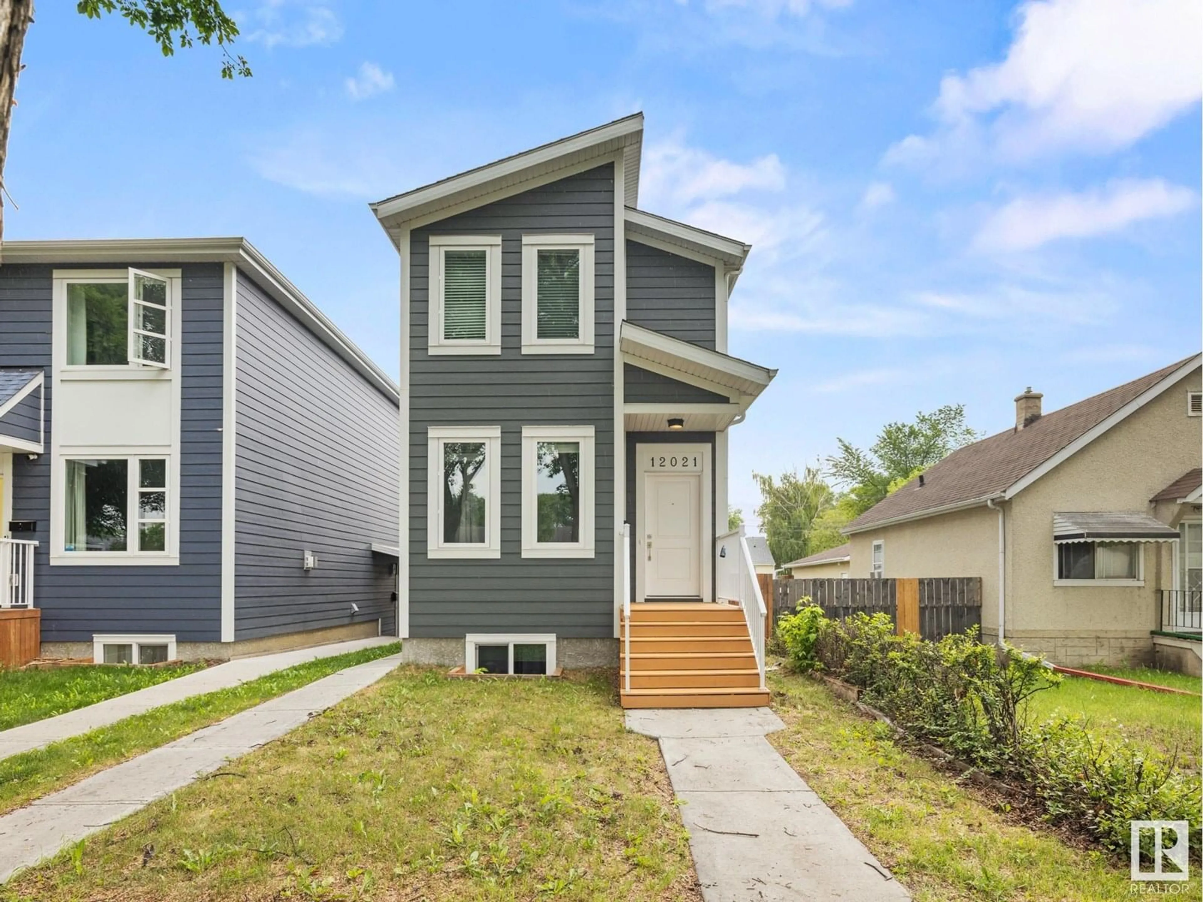 Home with vinyl exterior material, street for NW - 12021 40 ST, Edmonton Alberta T5W2L2