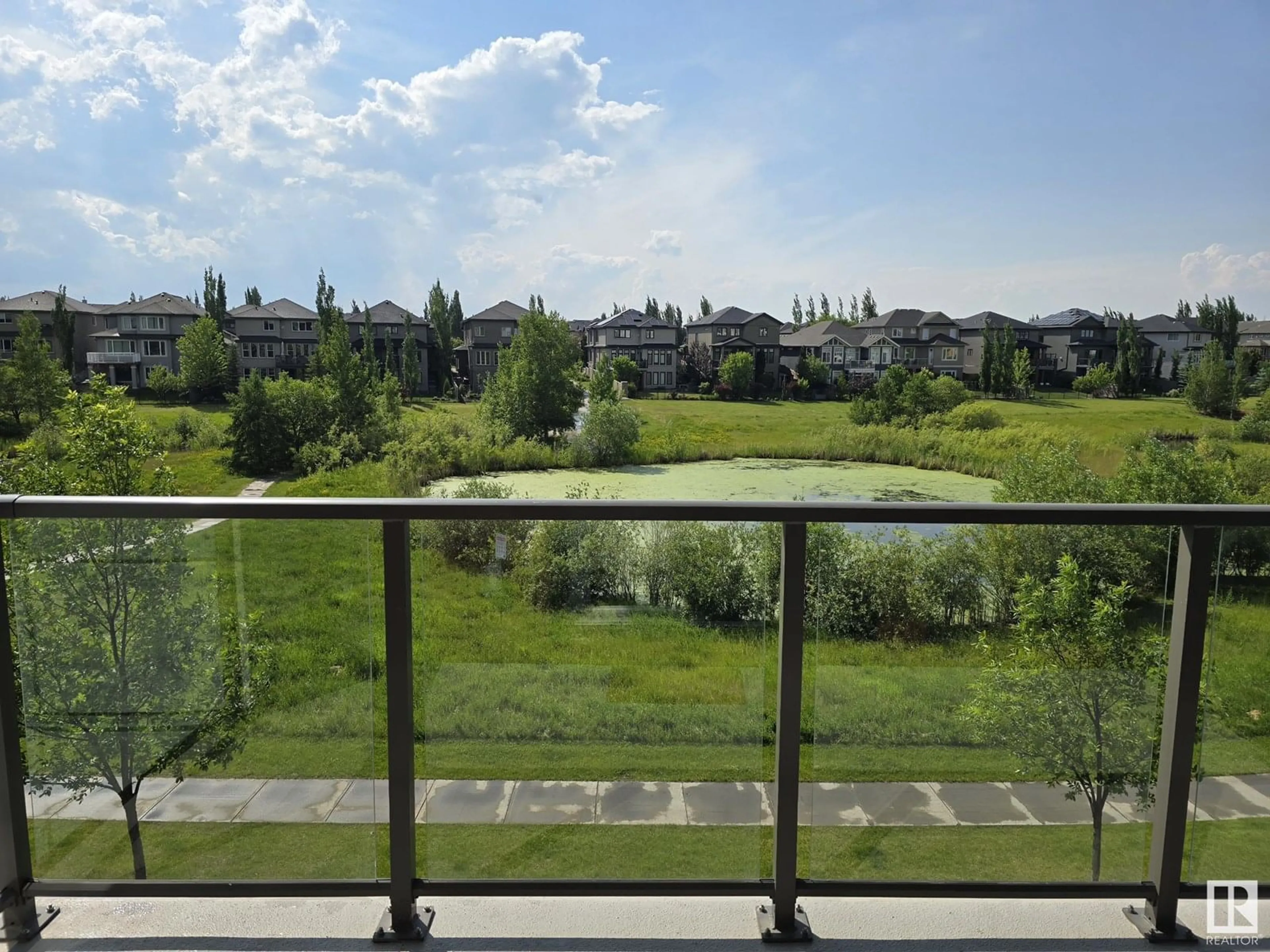 Balcony in the apartment, city buildings view from balcony for #206 - 1316 WINDERMERE WY, Edmonton Alberta T6W0P1