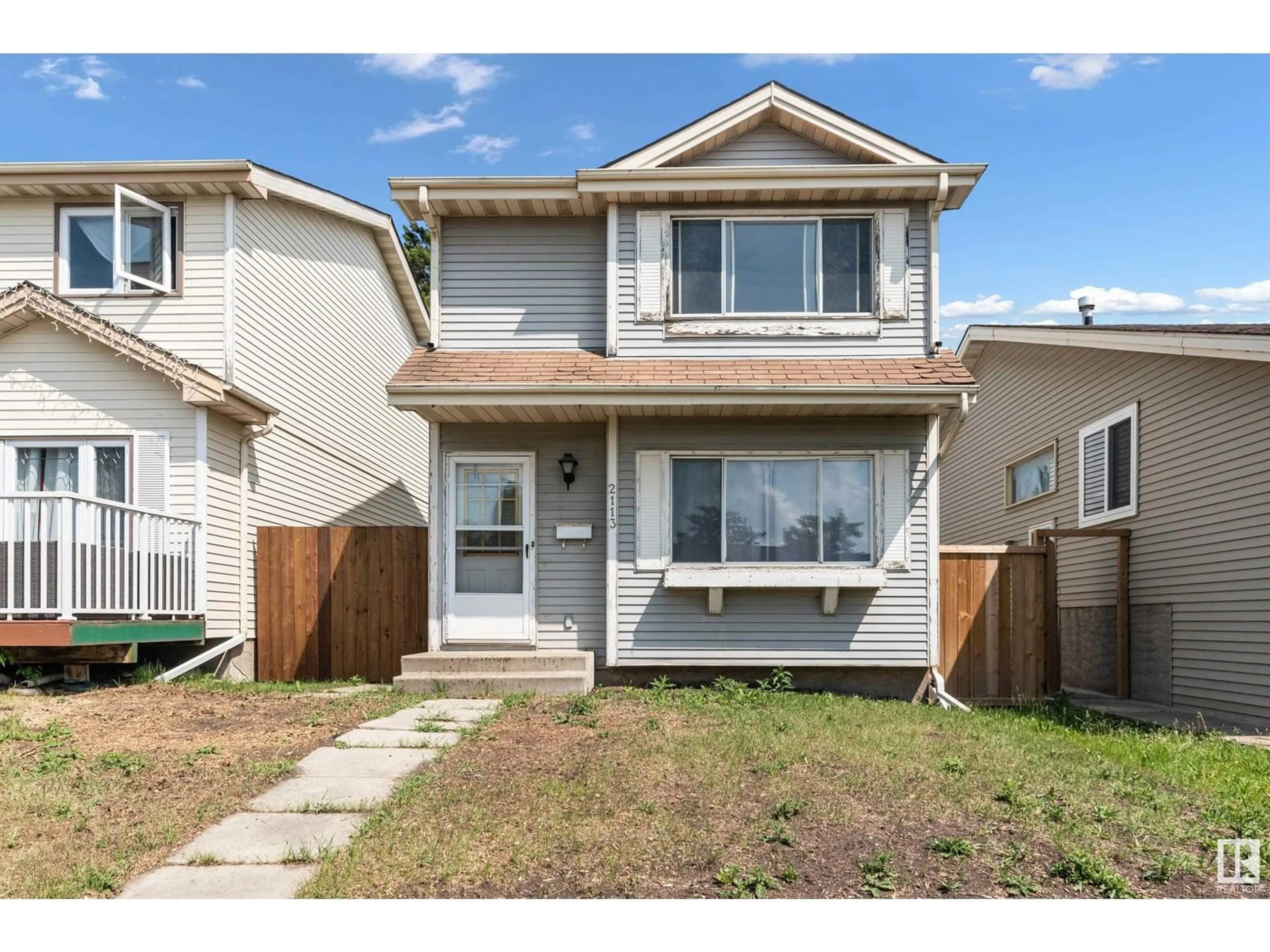 Home with vinyl exterior material, street for 2113 53 ST, Edmonton Alberta T6L4T8