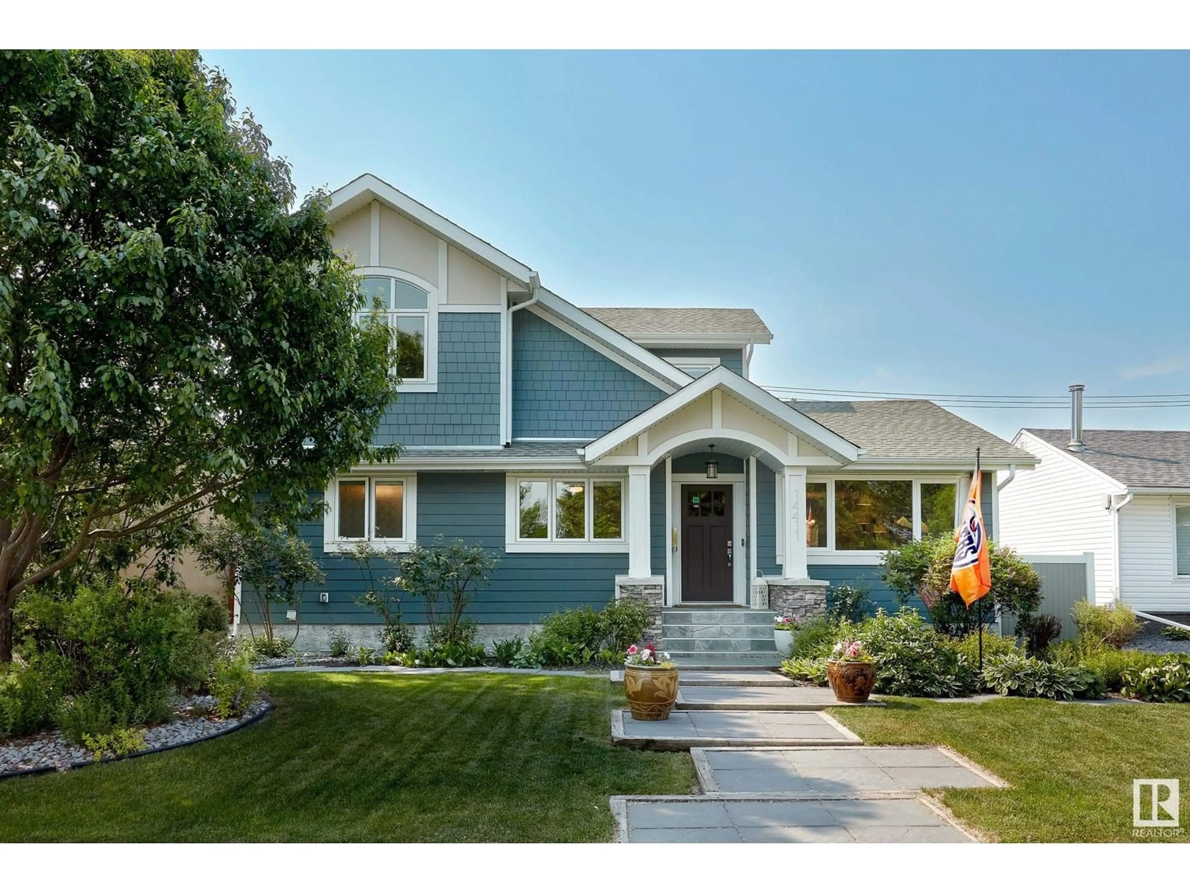 Home with vinyl exterior material, street for NW - 14411 91 AV, Edmonton Alberta T5R4Y5