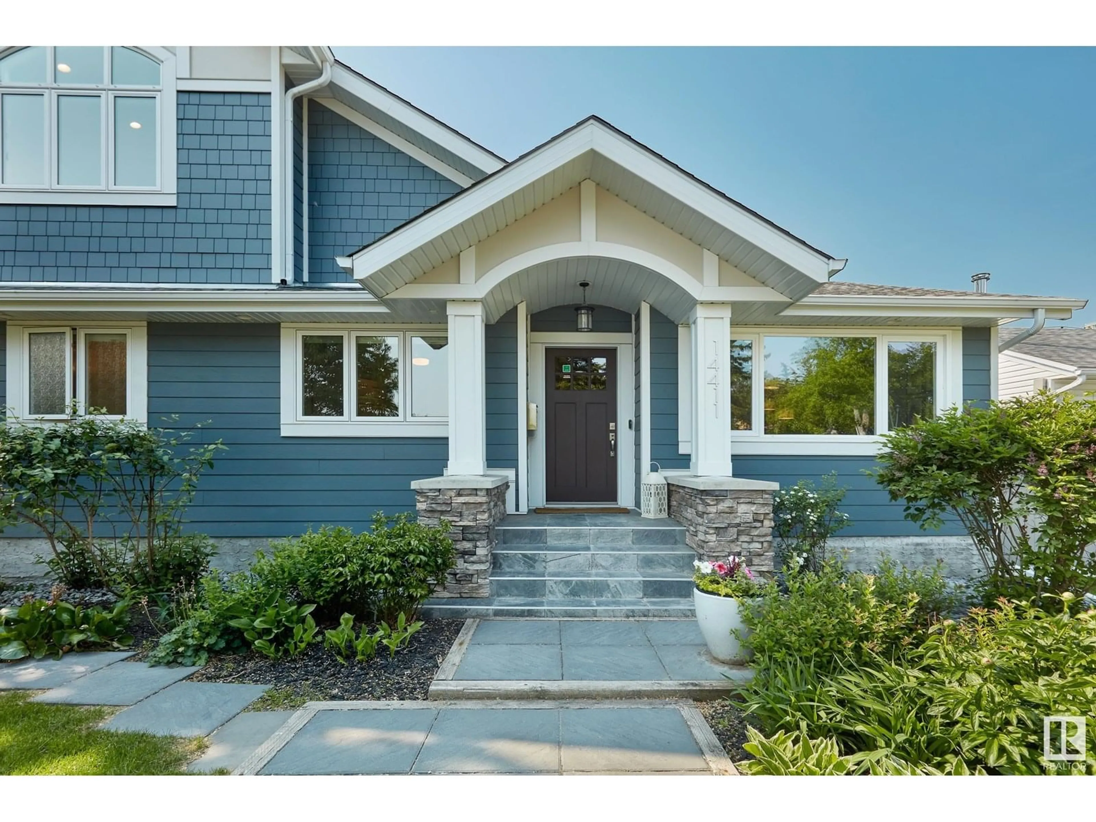 Home with vinyl exterior material, street for NW - 14411 91 AV, Edmonton Alberta T5R4Y5