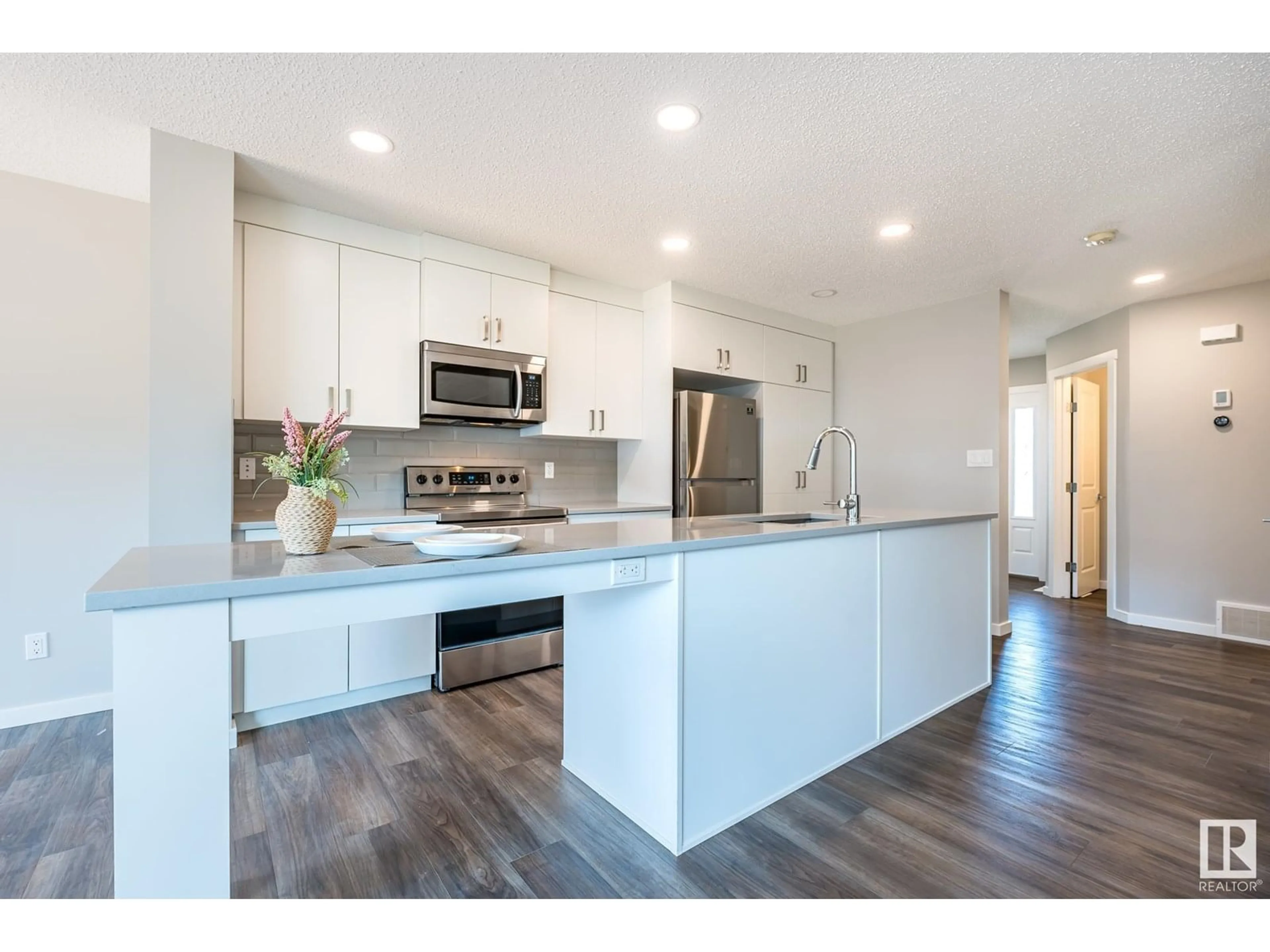 Open concept kitchen, wood/laminate floor for 2832 KOSHAL CR, Edmonton Alberta T6W3J7