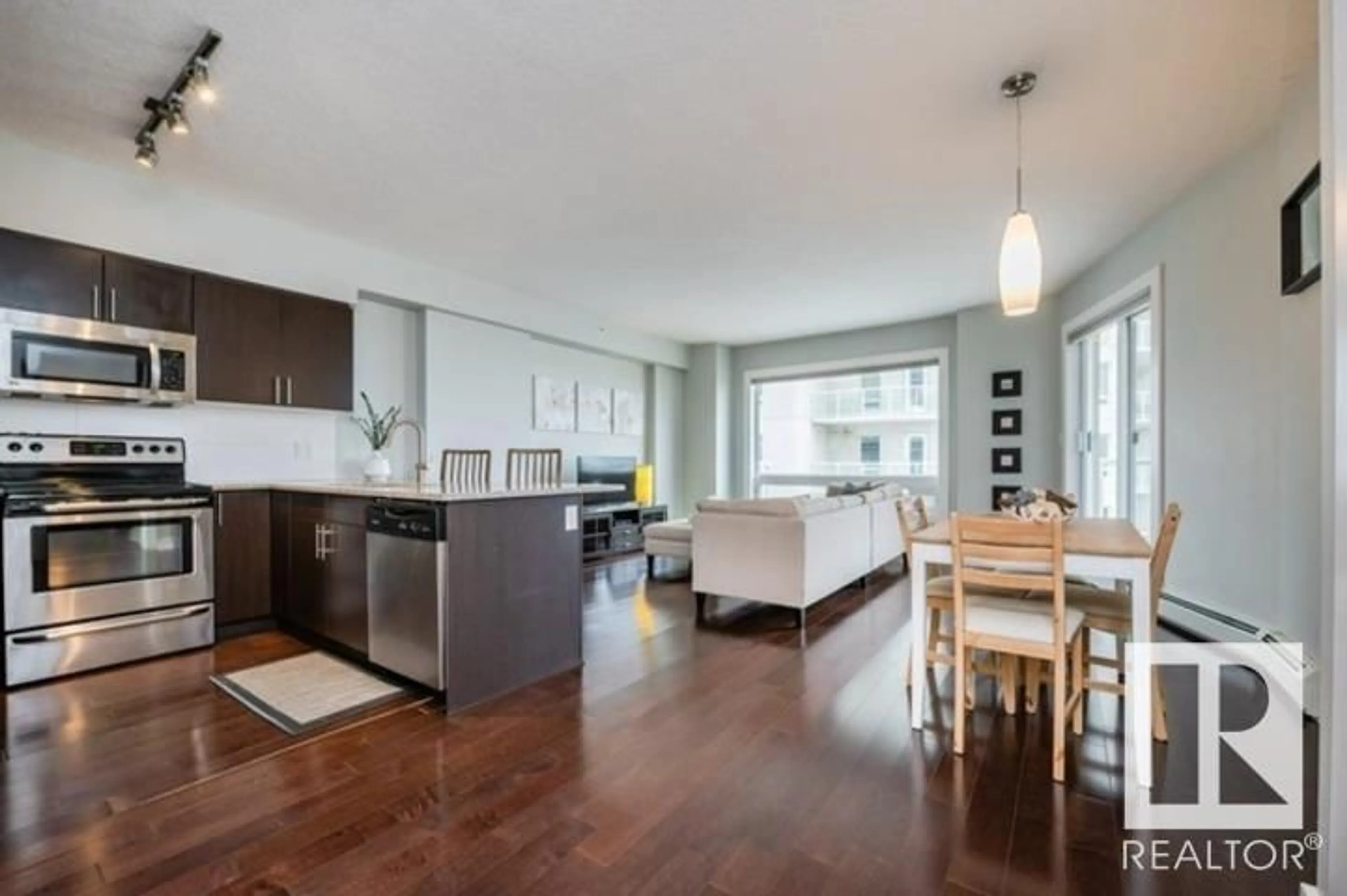 Open concept kitchen, wood/laminate floor for 10152 - 1705 104 ST NW, Edmonton Alberta T5J0B6