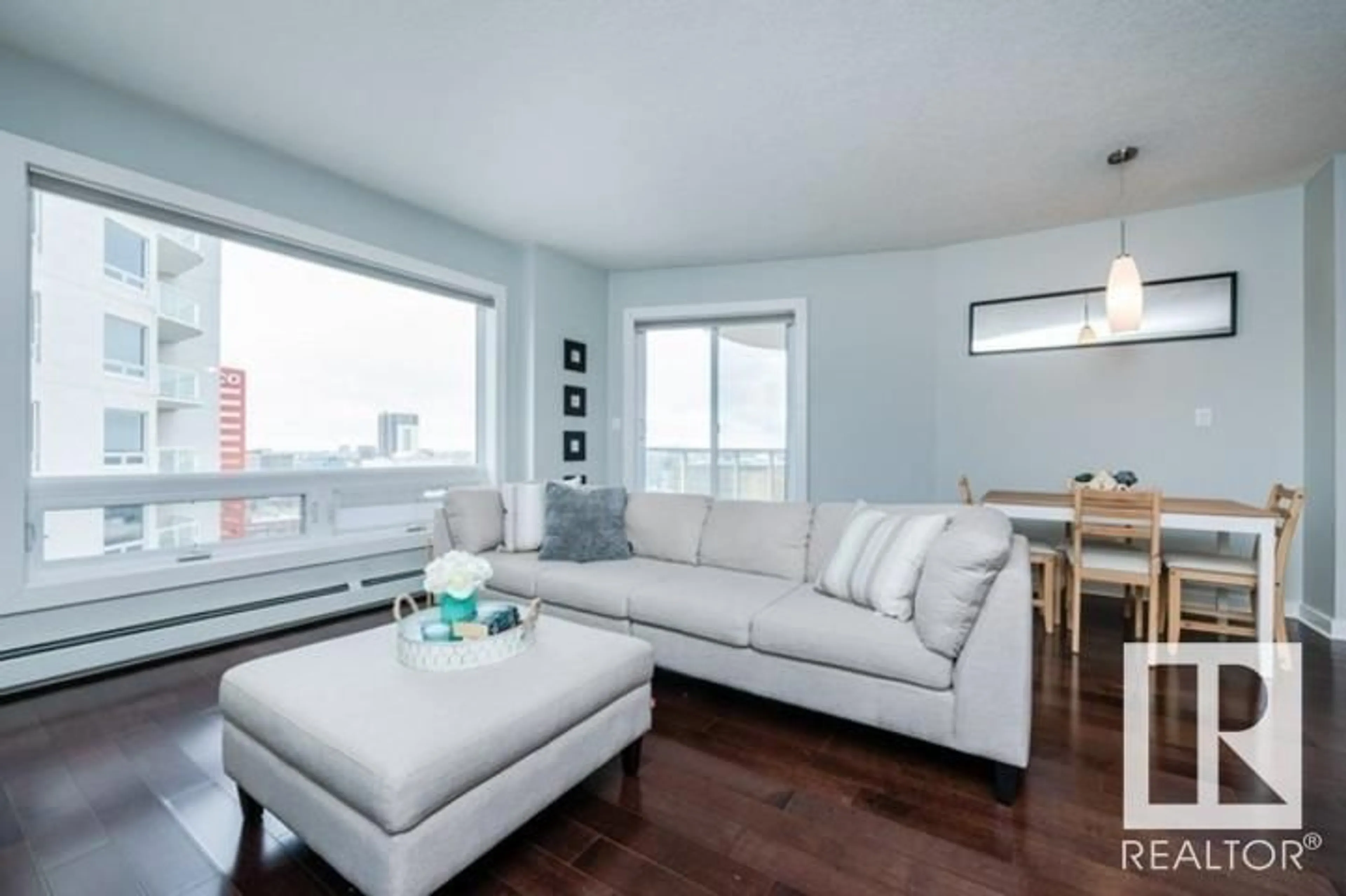 Living room with furniture, wood/laminate floor for 10152 - 1705 104 ST NW, Edmonton Alberta T5J0B6