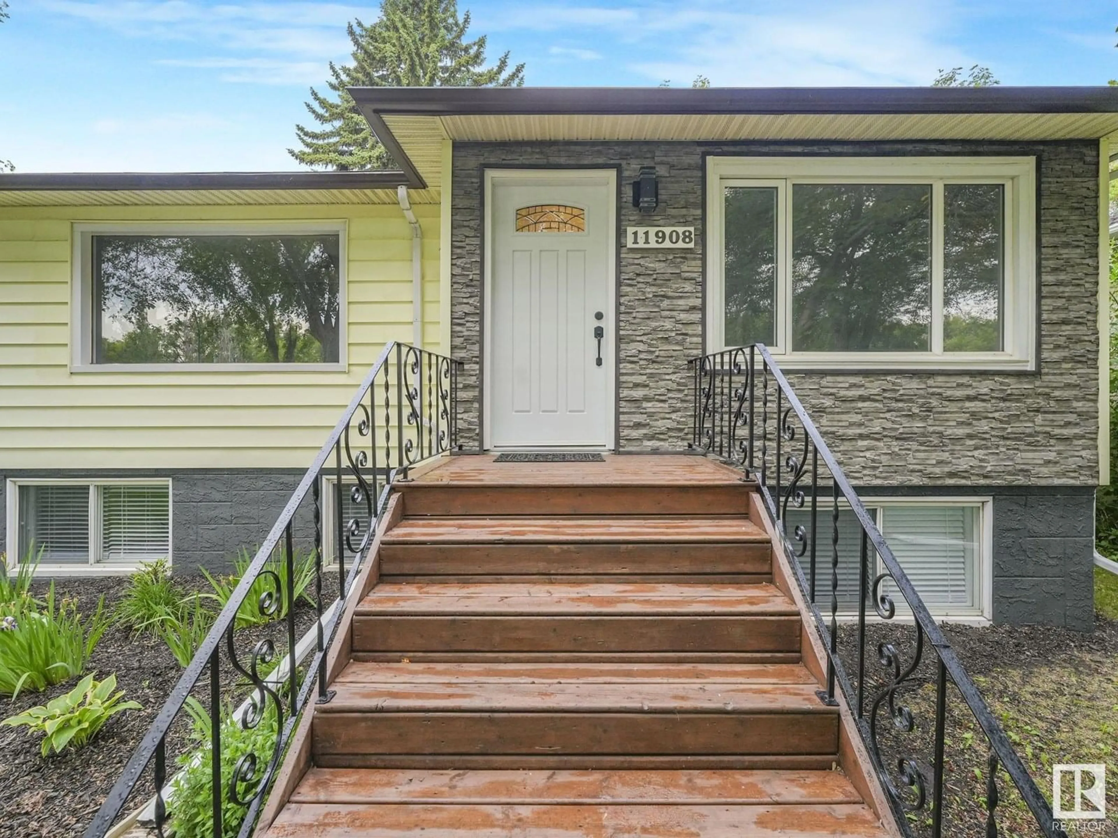Home with vinyl exterior material, street for NW - 11908 52 ST, Edmonton Alberta T5W3J6