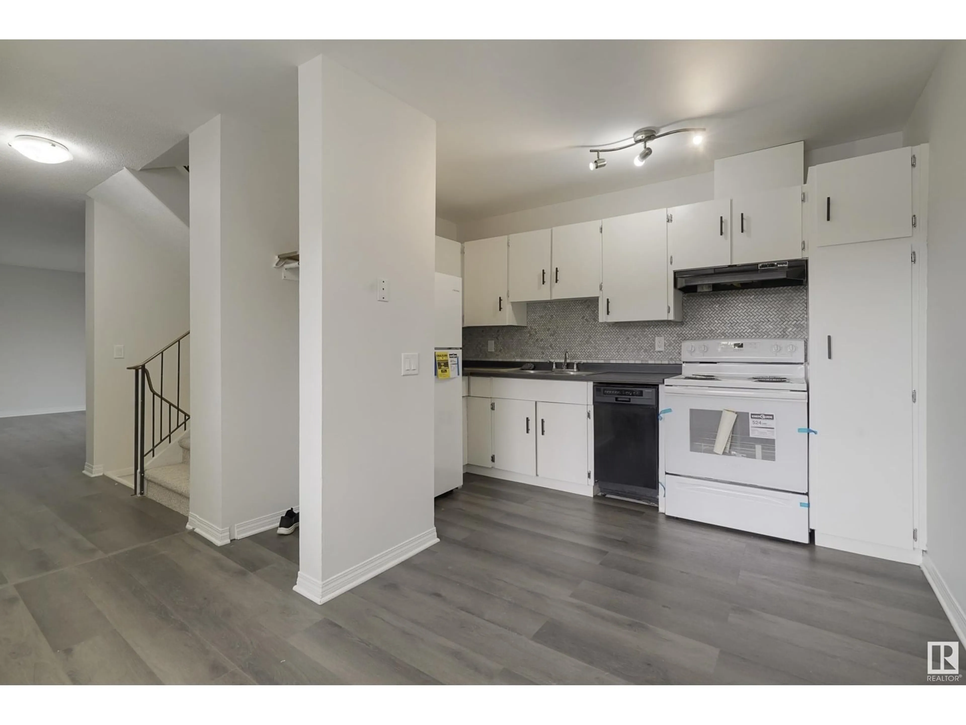 Open concept kitchen, wood/laminate floor for 17751 95 ST, Edmonton Alberta T5Z2E3