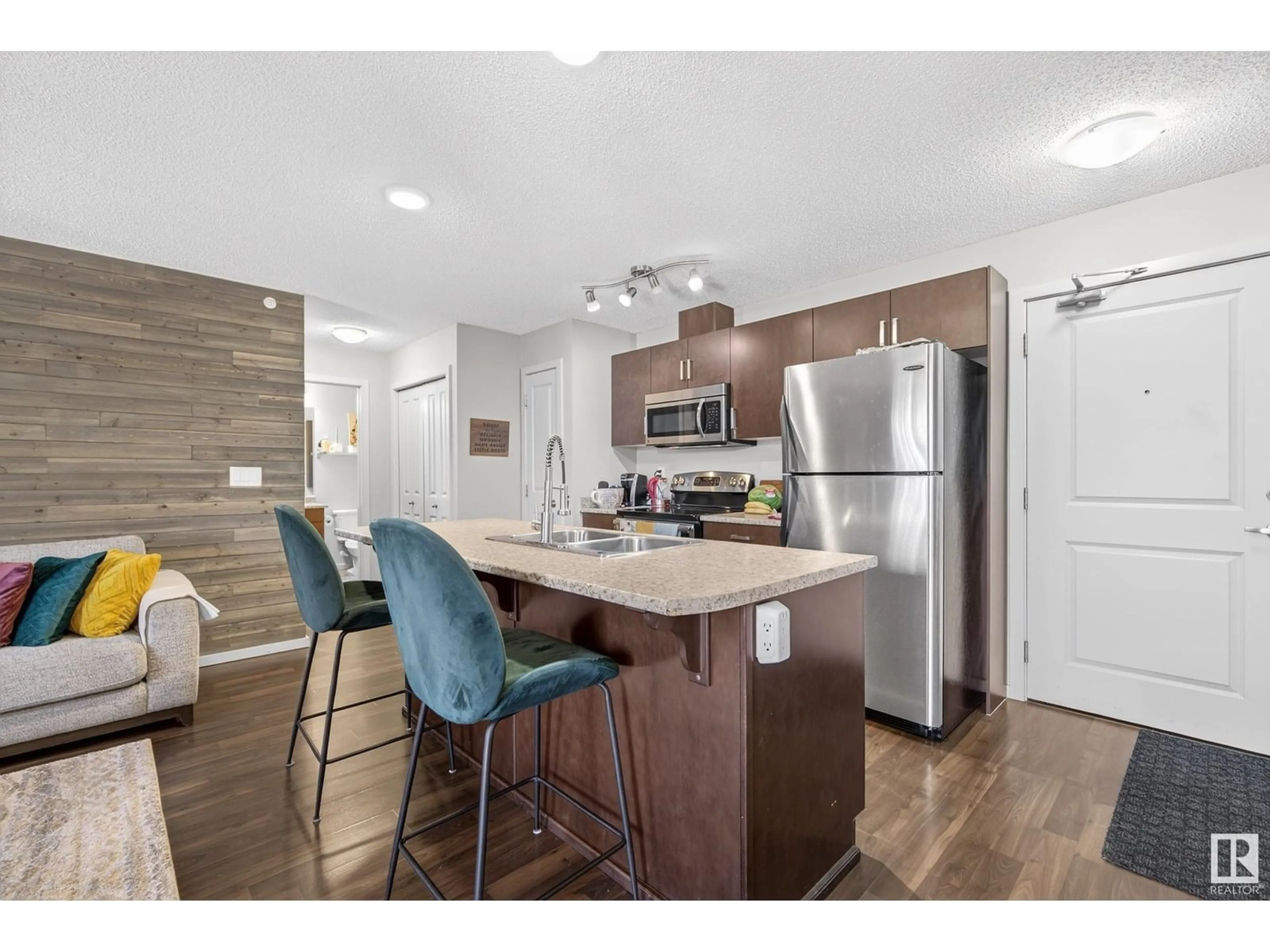 Open concept kitchen, wood/laminate floor for 407 - 5521 7 AV SW, Edmonton Alberta T6X2A8