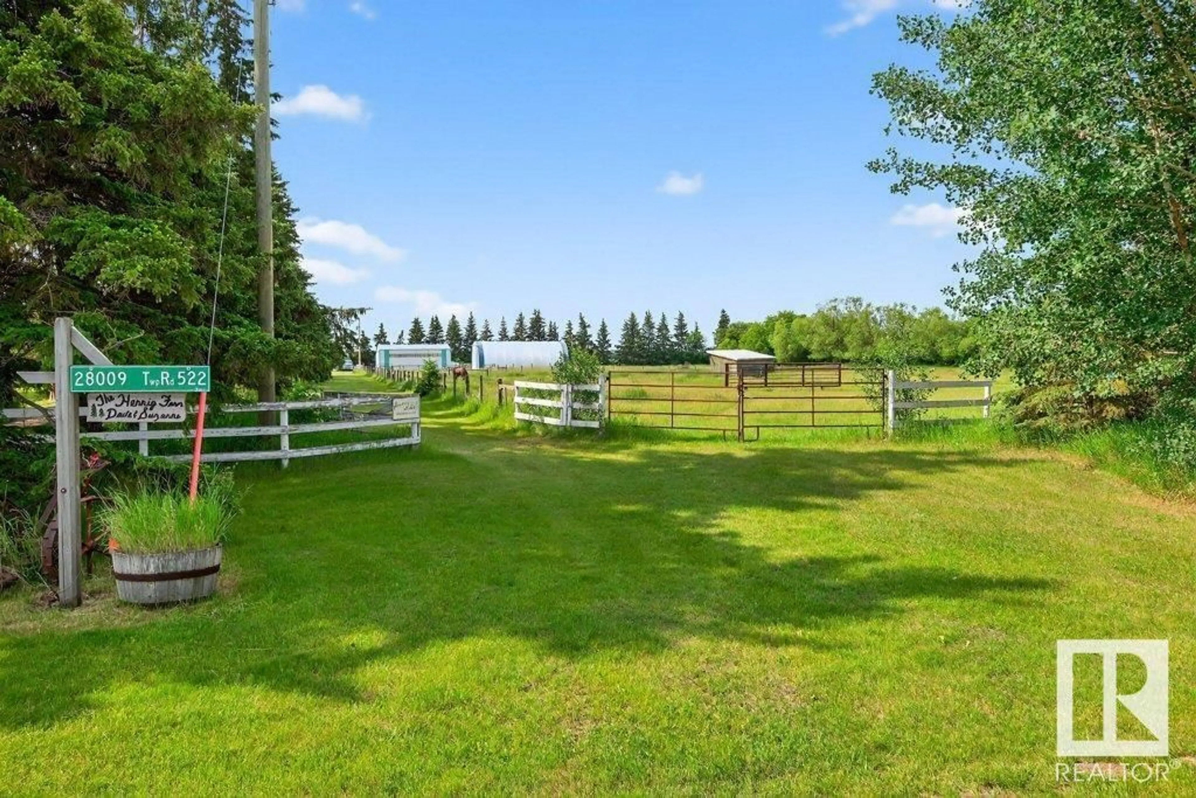 A pic from outside/outdoor area/front of a property/back of a property/a pic from drone, water/lake/river/ocean view for 28009 TWP 522, Rural Parkland County Alberta T7X3S3