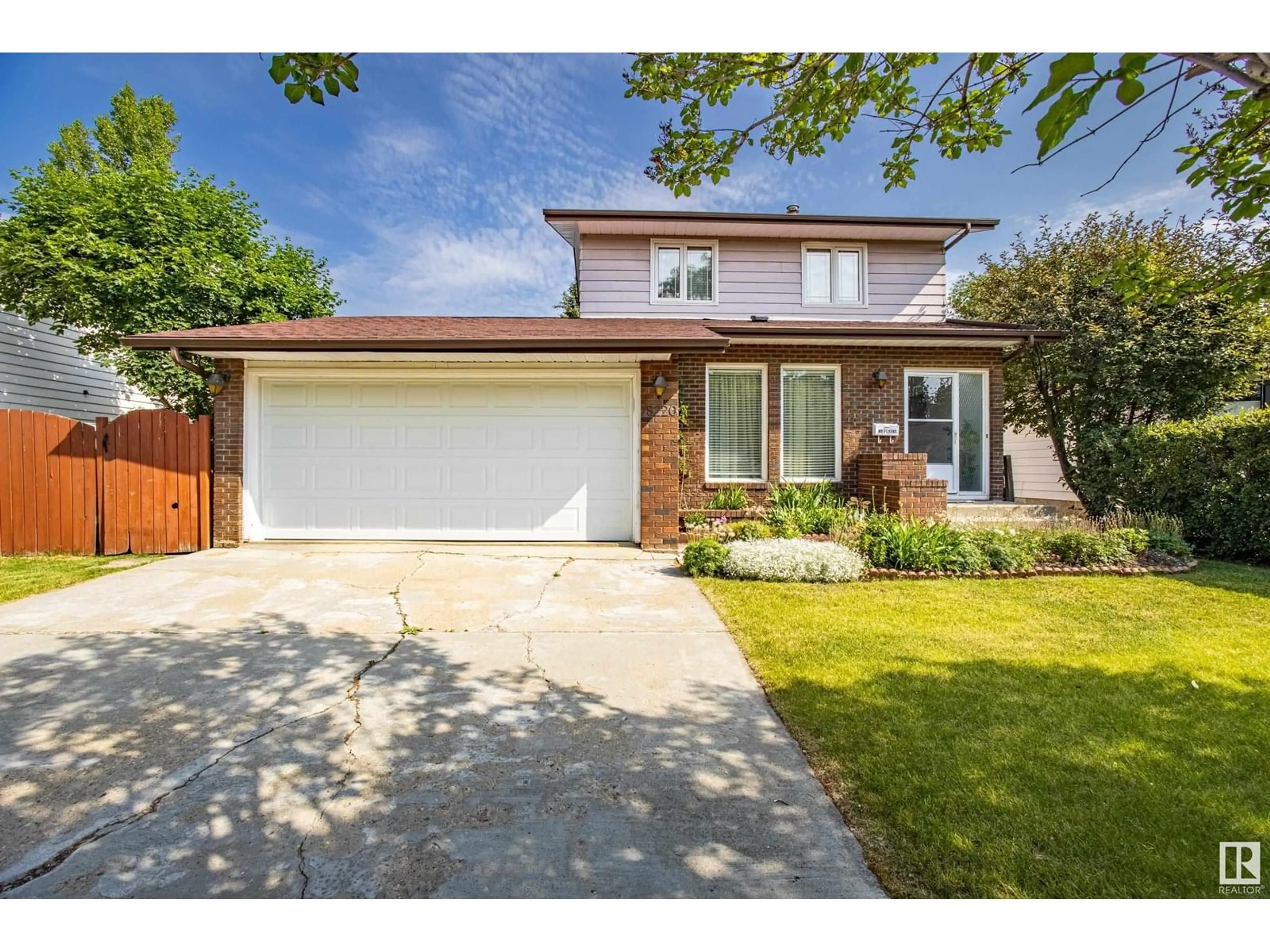 Home with brick exterior material, street for 18220 74 AV, Edmonton Alberta T5T2L2