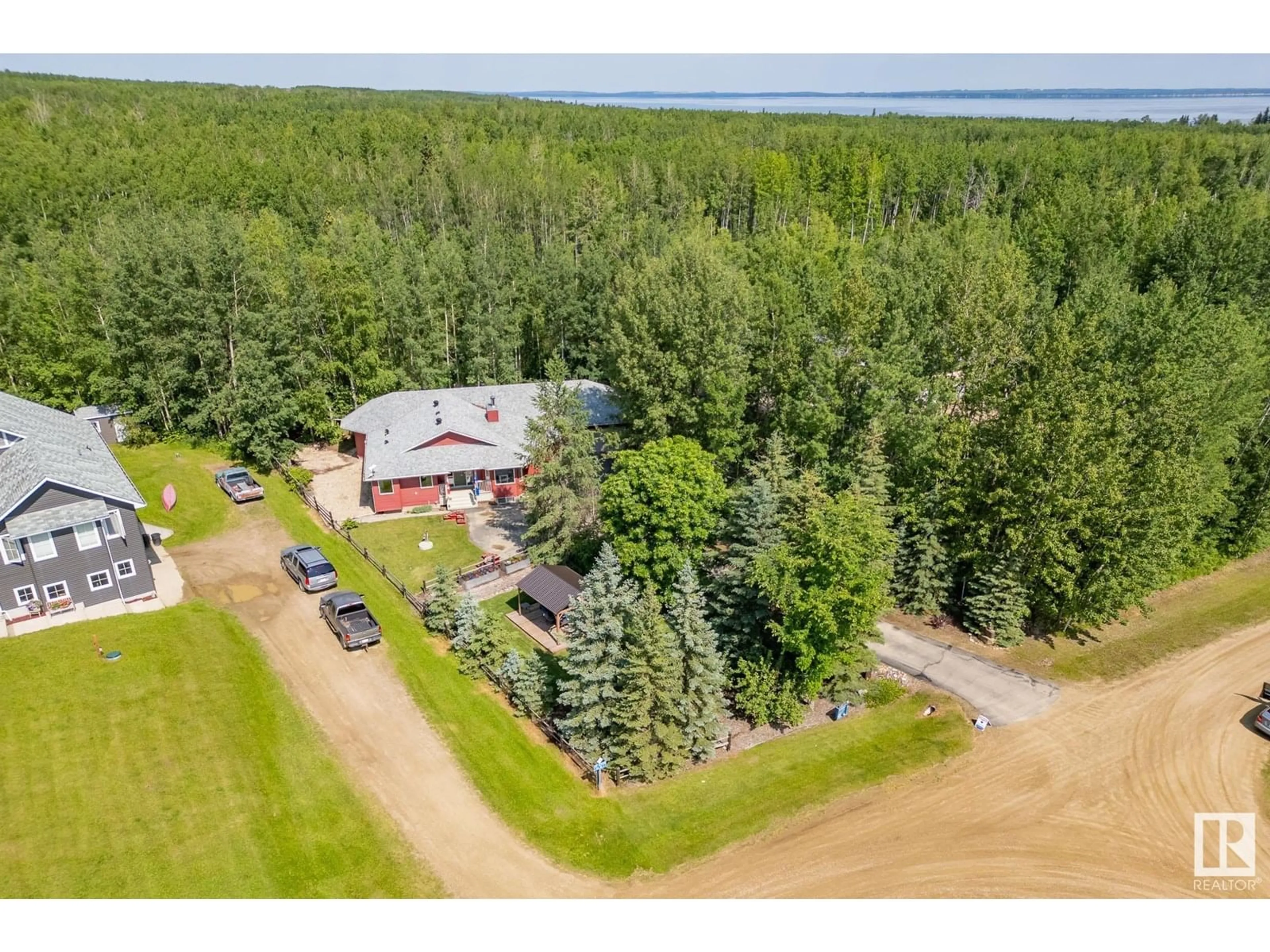 A pic from outside/outdoor area/front of a property/back of a property/a pic from drone, water/lake/river/ocean view for 148 462028 RGE RD 11, Rural Wetaskiwin County Alberta T0C2V0