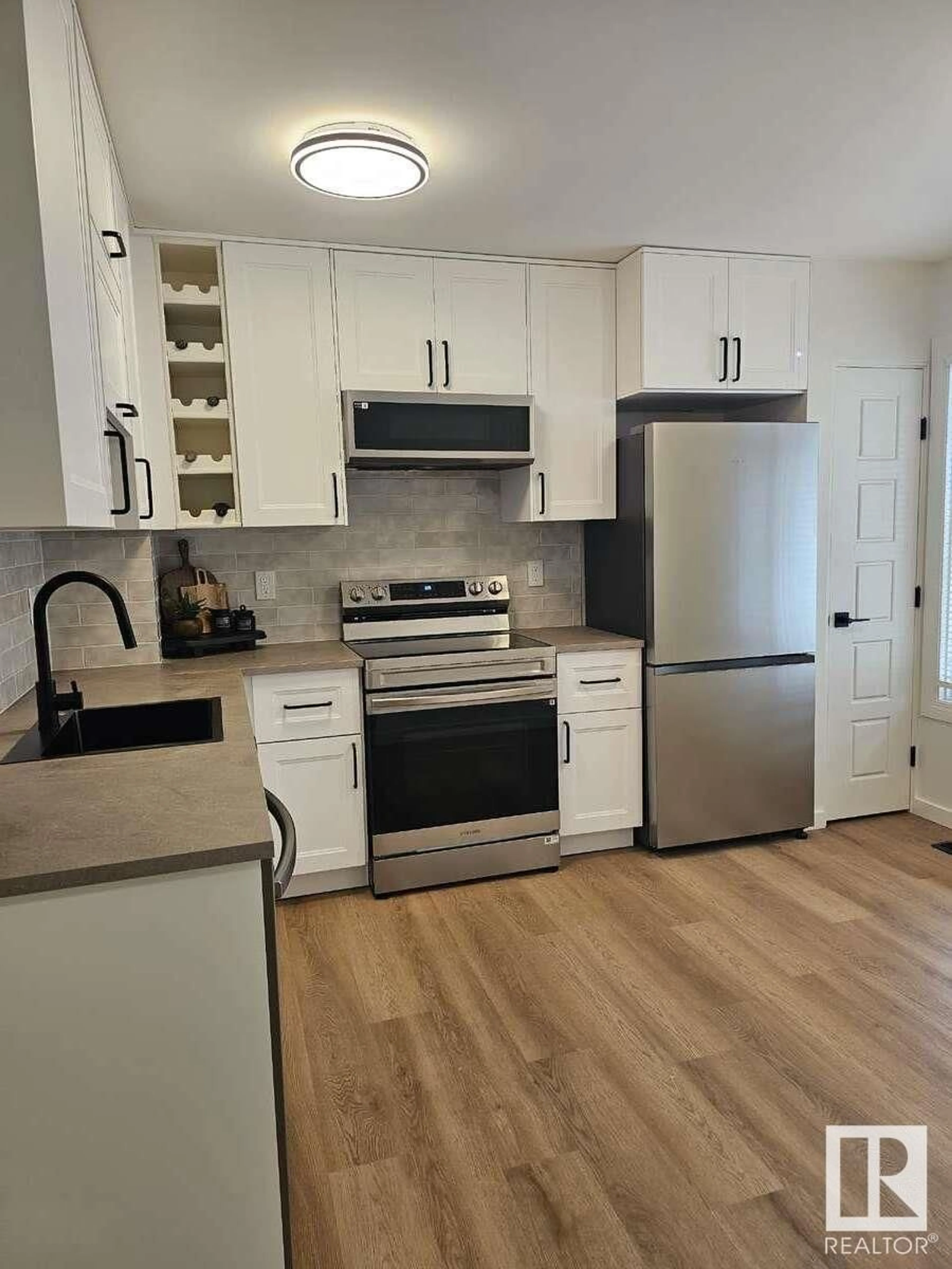 Open concept kitchen, wood/laminate floor for 19 2030 BRENTWOOD BV, Sherwood Park Alberta T8A4P6