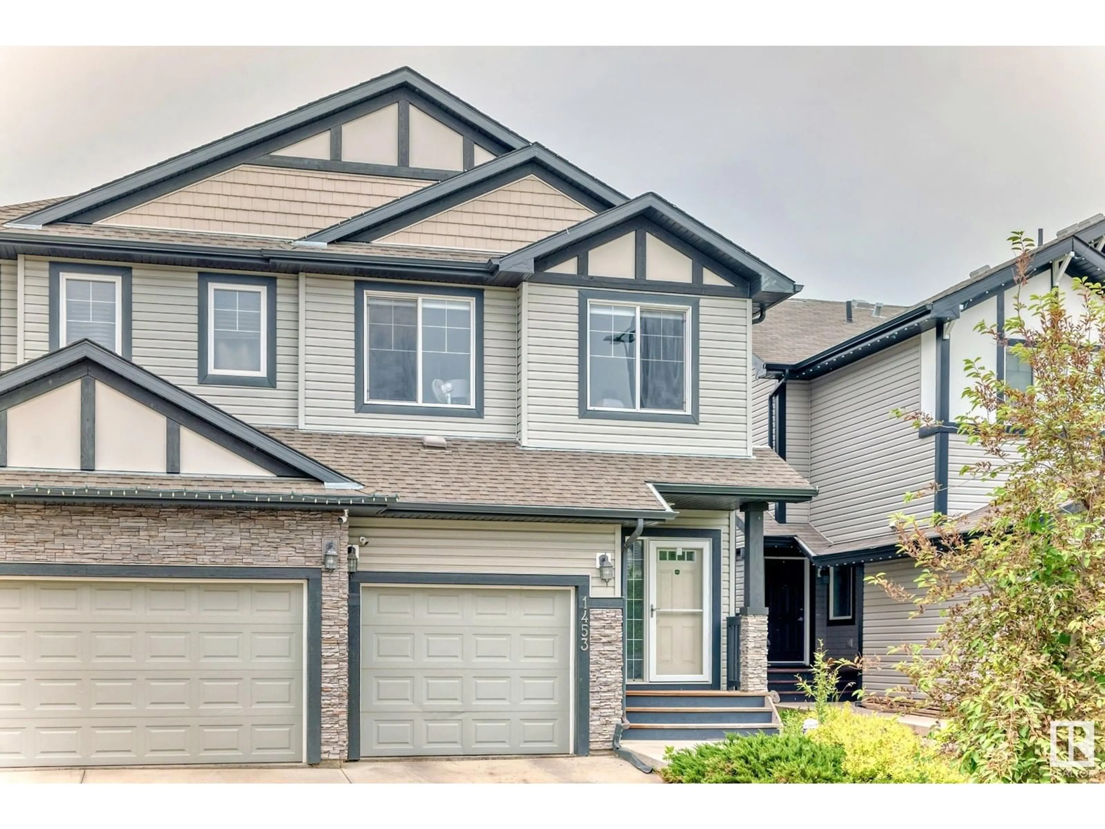 Home with vinyl exterior material, street for 1453 33A ST, Edmonton Alberta T6T0V3