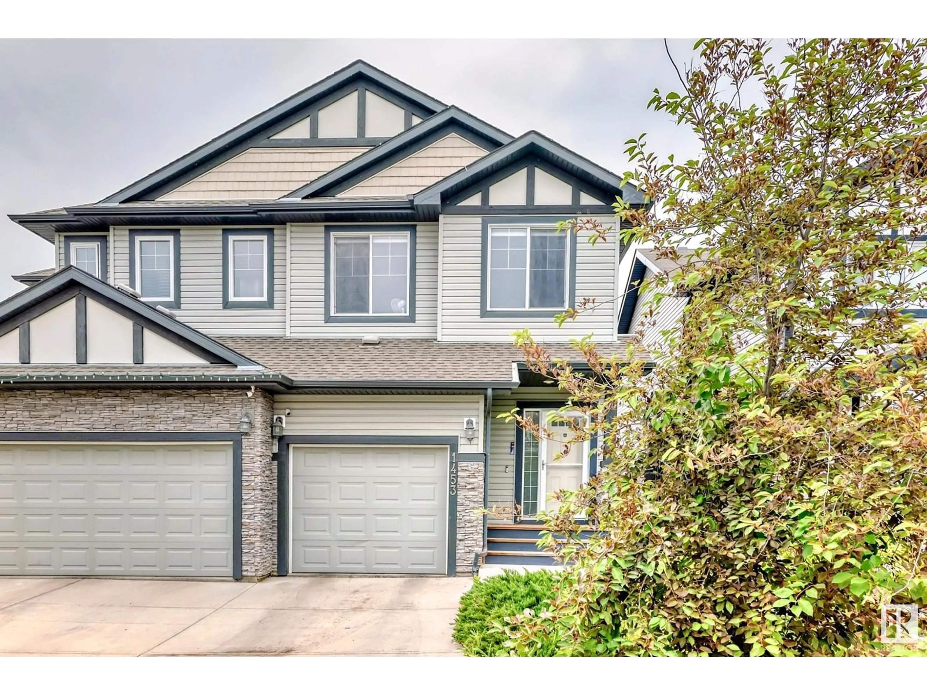 Home with vinyl exterior material, street for 1453 33A ST, Edmonton Alberta T6T0V3