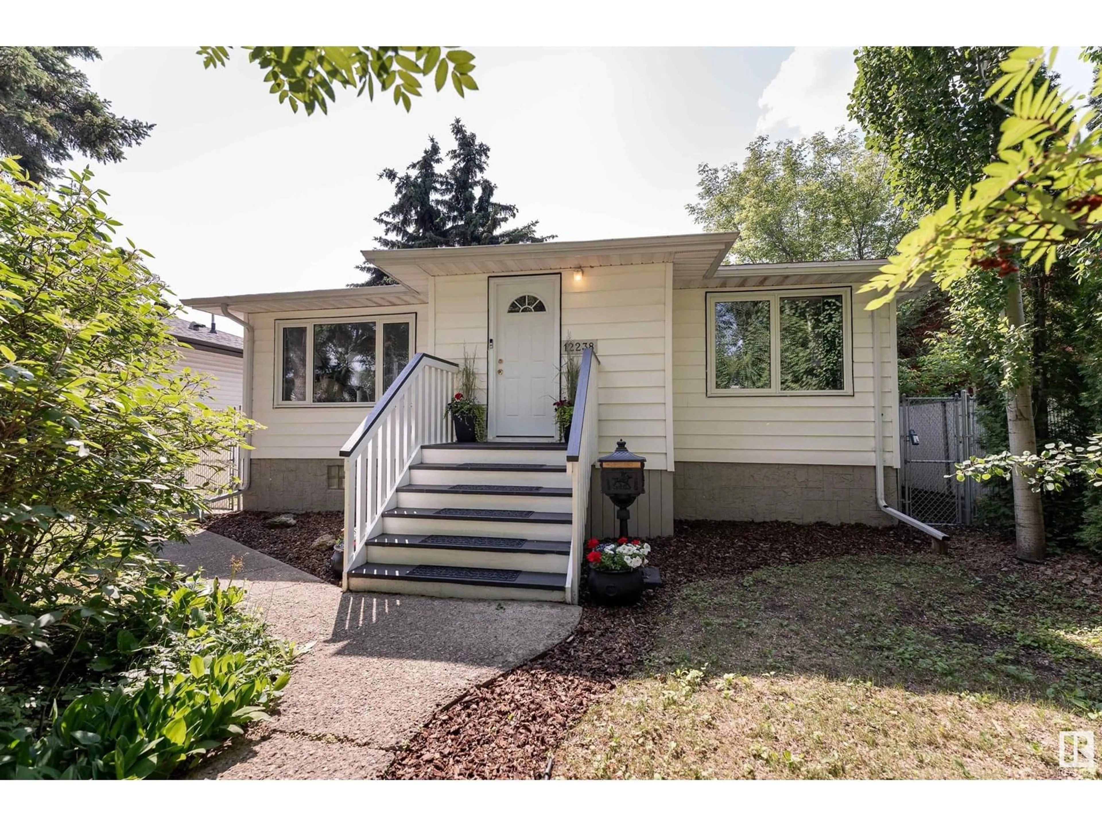 Home with vinyl exterior material, street for NW - 12238 94 ST, Edmonton Alberta T5G1K1