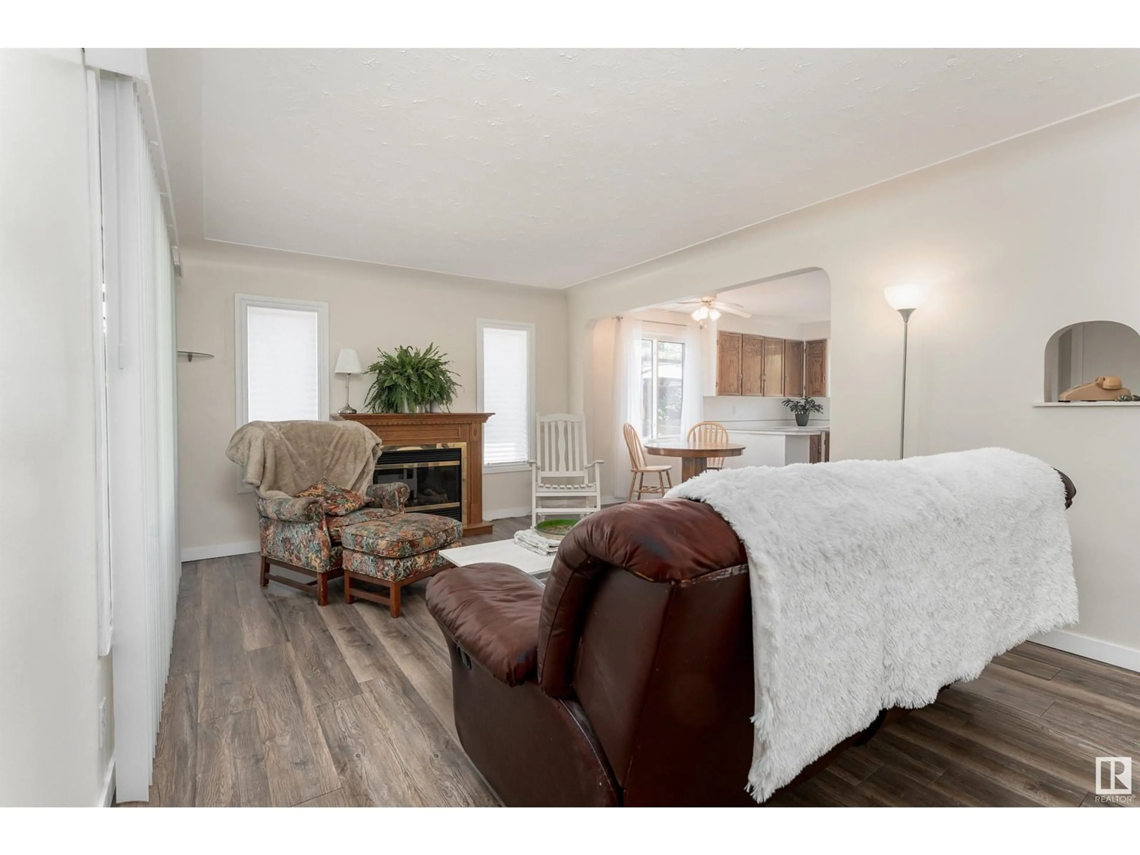 Living room with furniture, wood/laminate floor for NW - 12238 94 ST, Edmonton Alberta T5G1K1