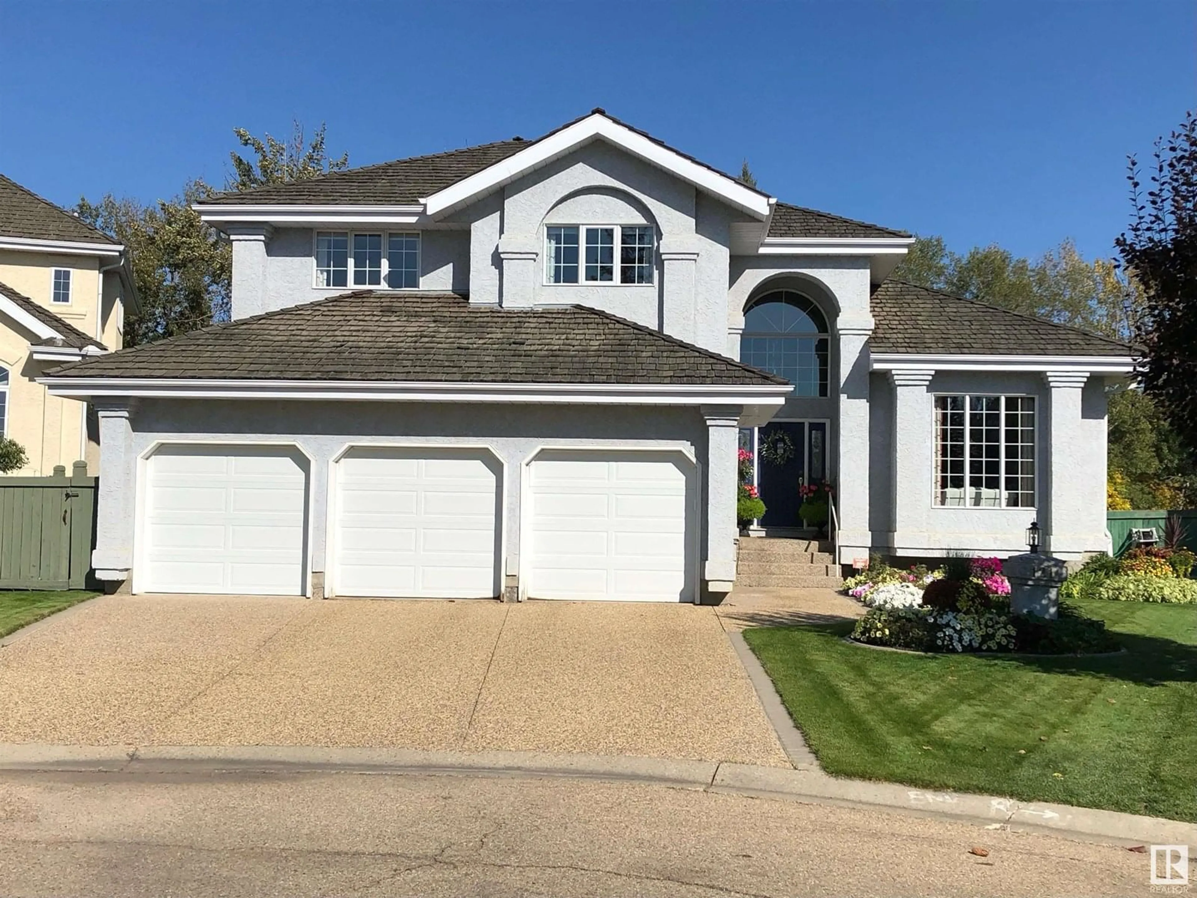 Home with vinyl exterior material, street for 121 WEAVER DR, Edmonton Alberta T6M2J3