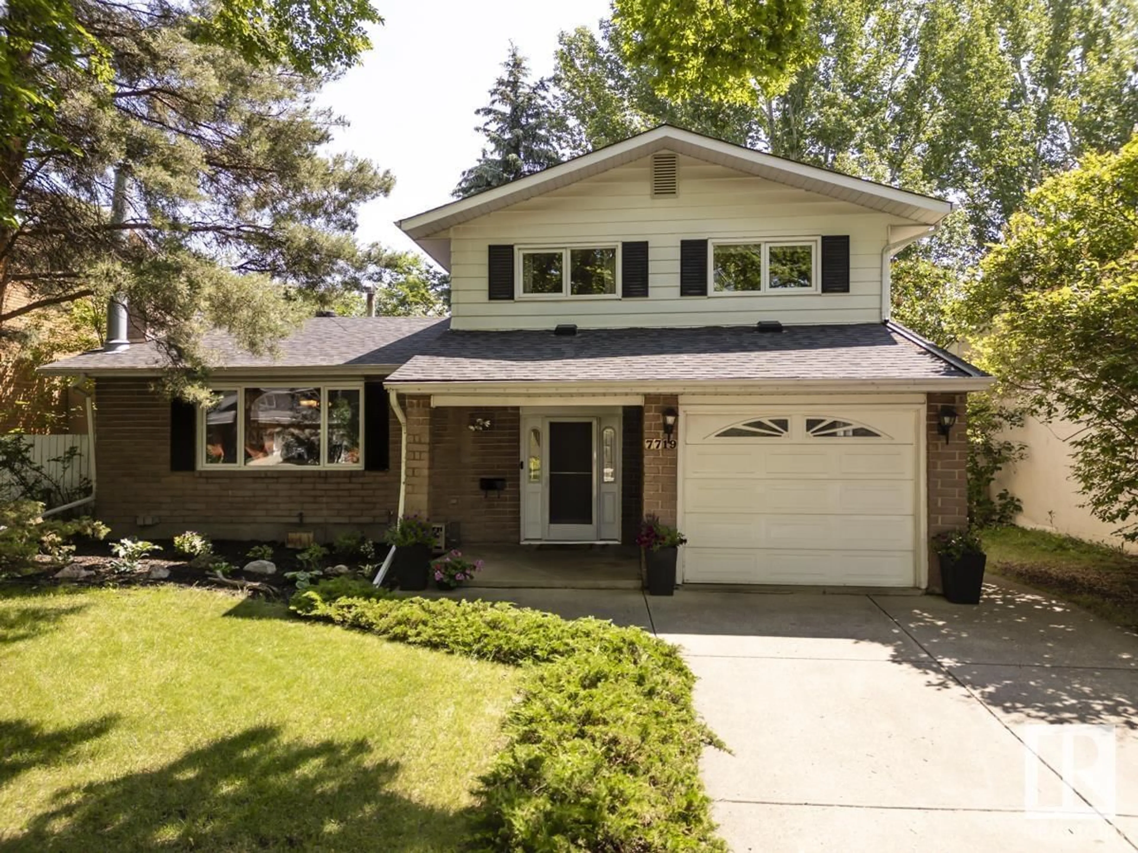 Home with vinyl exterior material, street for NW - 7719 157 ST, Edmonton Alberta T5R2A1