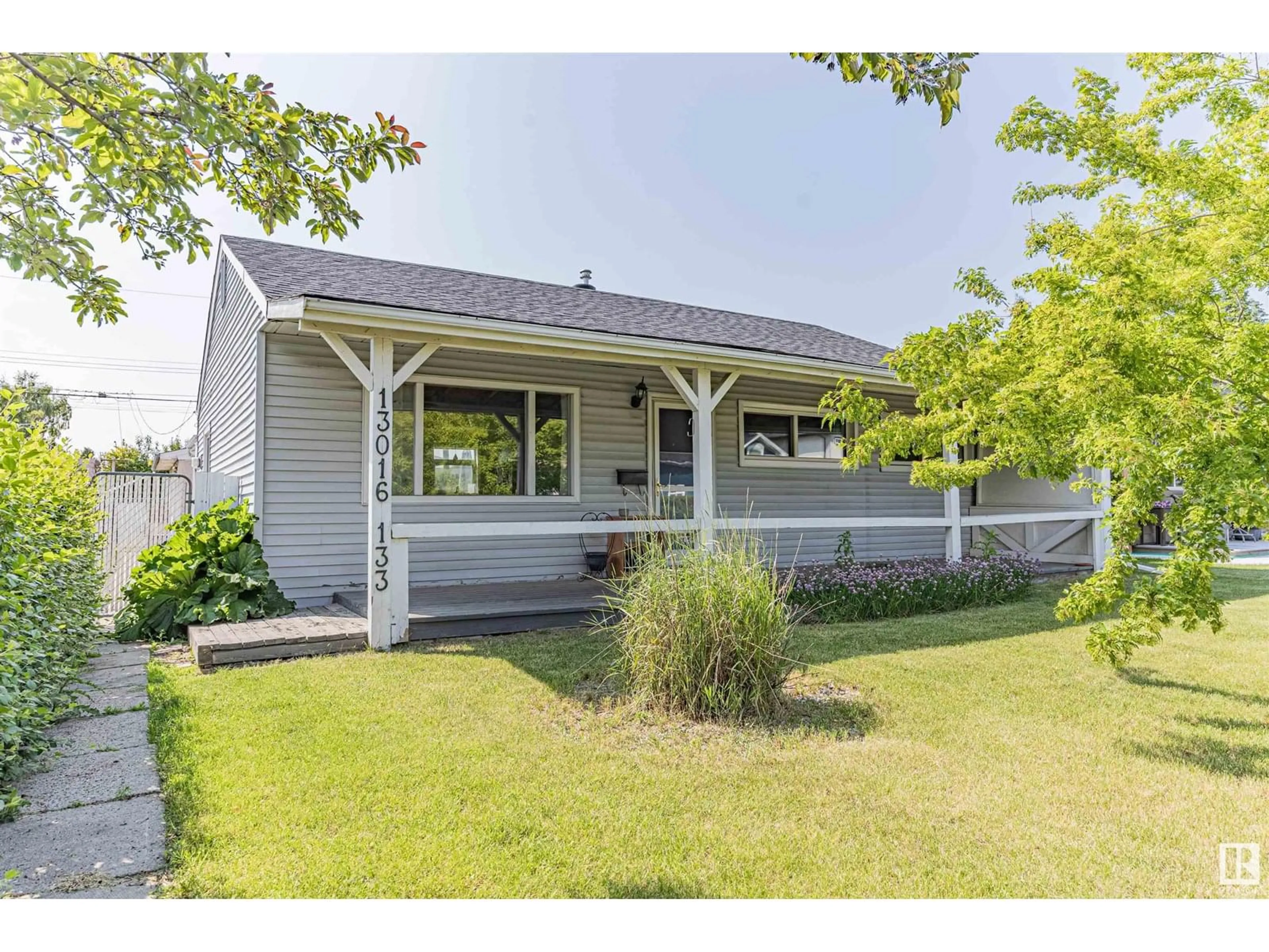 Home with vinyl exterior material, street for 13016 133 ST, Edmonton Alberta T5L1T1