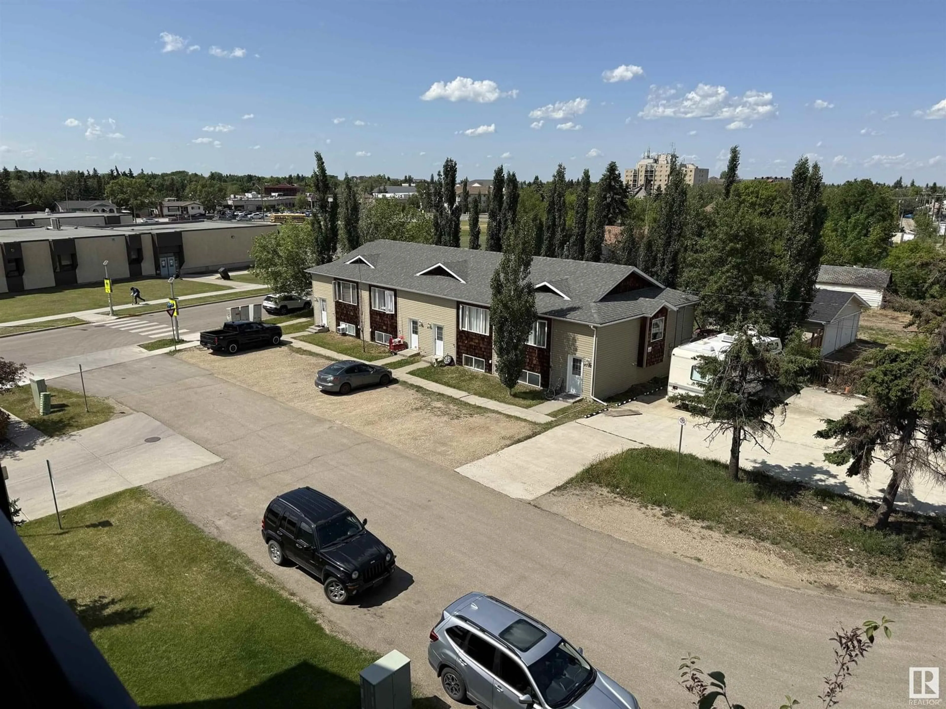 A pic from outside/outdoor area/front of a property/back of a property/a pic from drone, unknown for #402 - 4415 48 ST, Leduc Alberta T9E5Y3