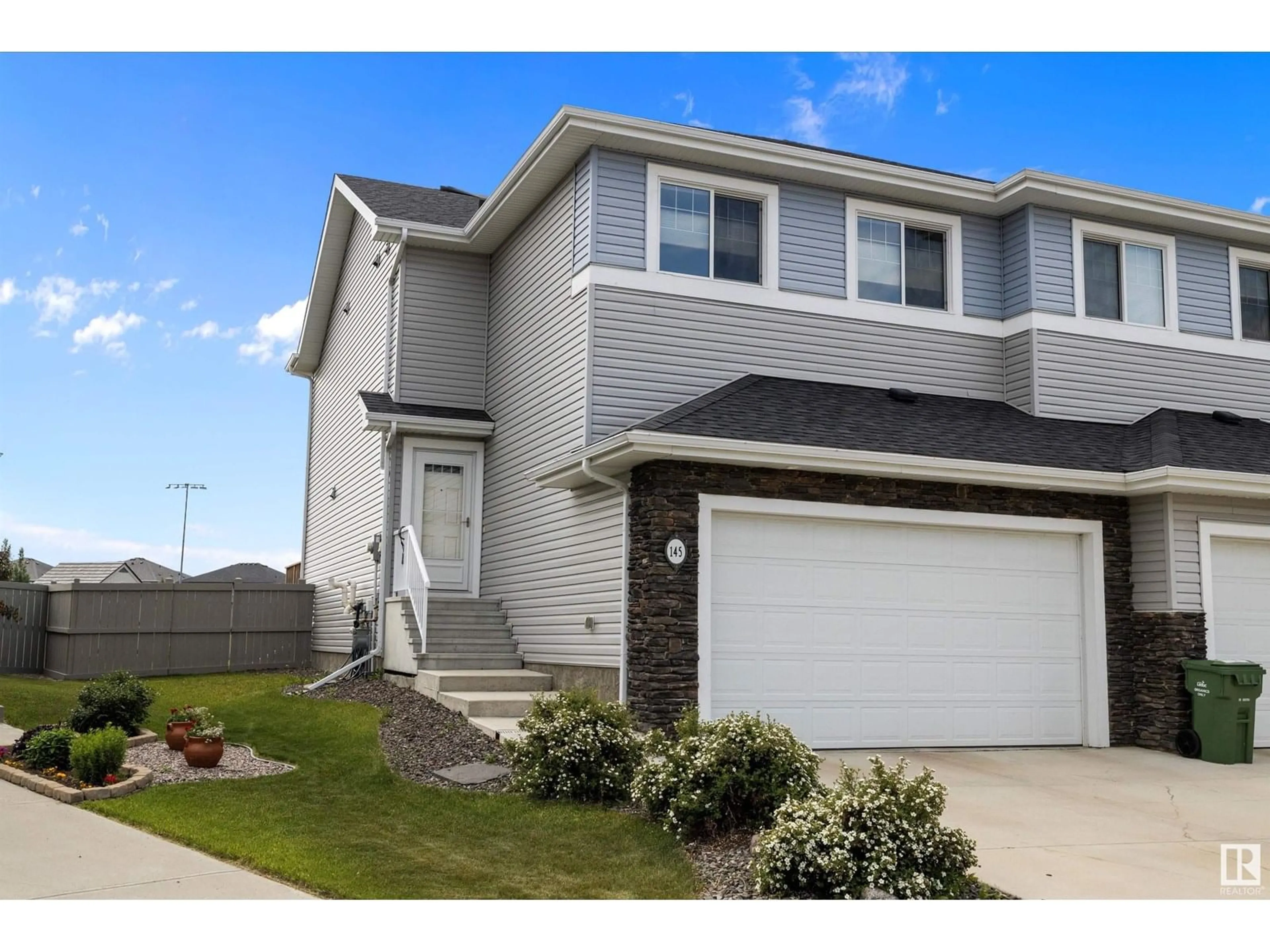 Home with vinyl exterior material, street for 145 REED PL, Leduc Alberta T9E1B1