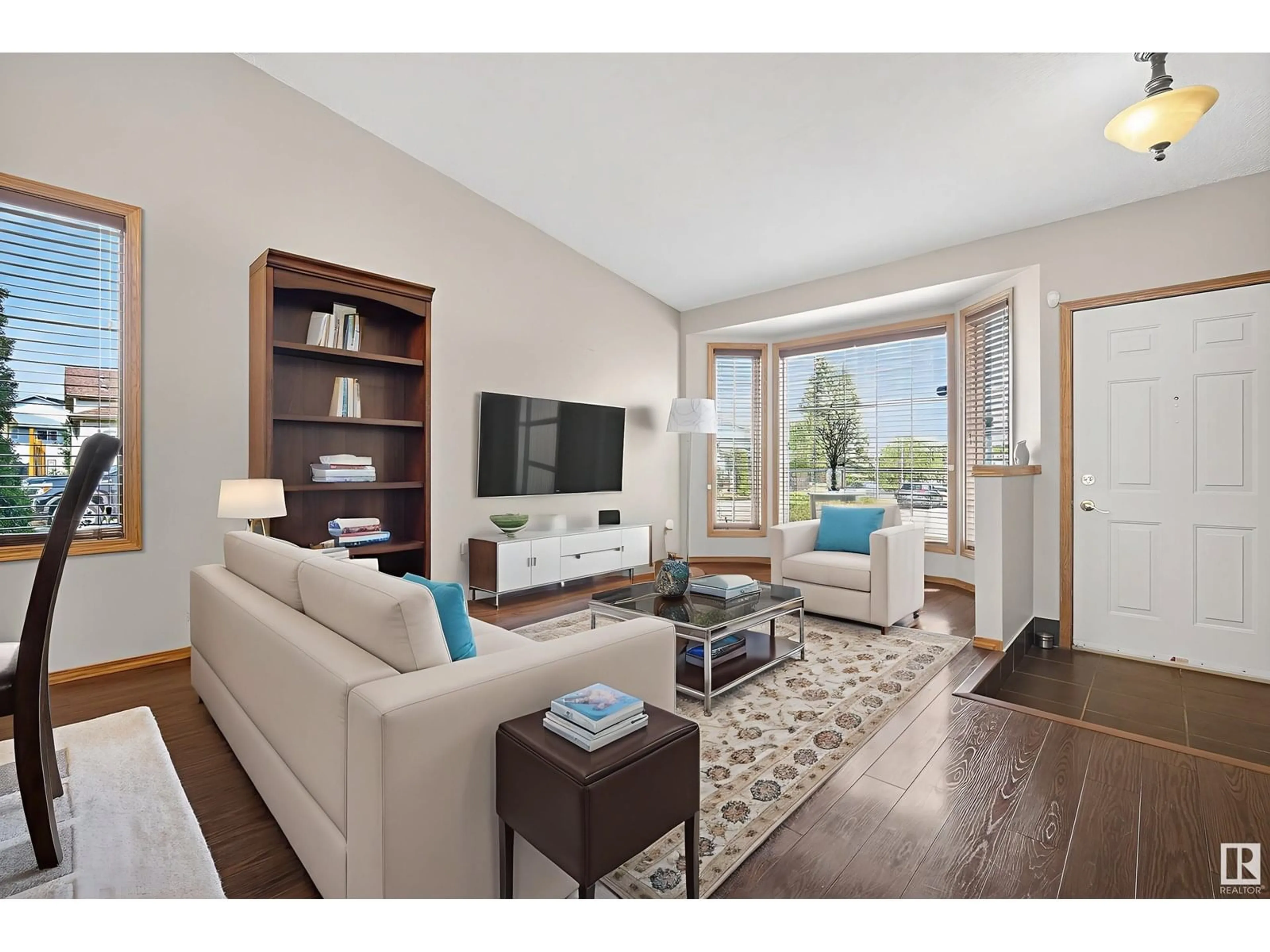 Living room with furniture, wood/laminate floor for 3627 40 AV, Edmonton Alberta T6L6M8