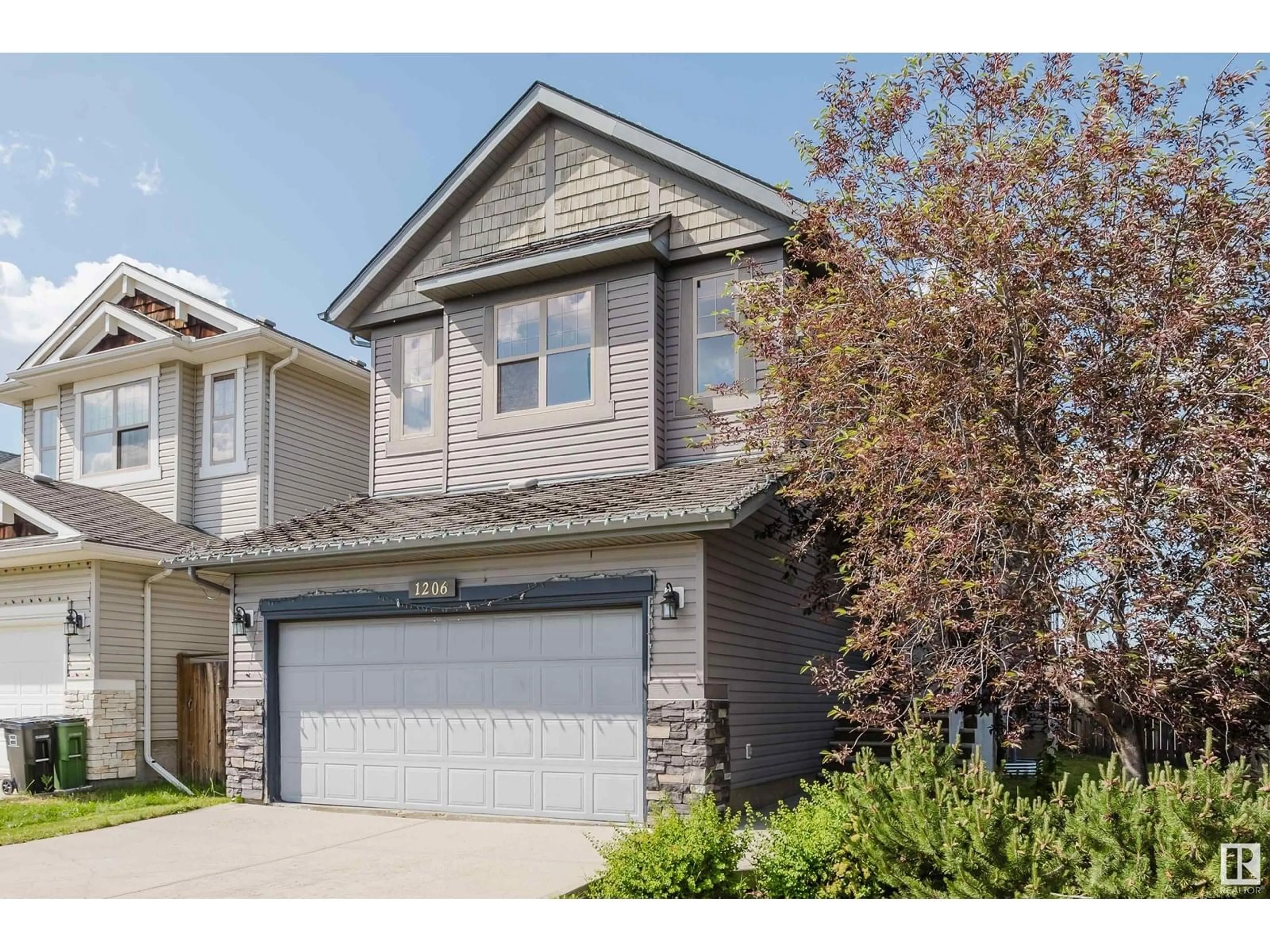 Home with vinyl exterior material, street for 1206 37 AV, Edmonton Alberta T6T0J5