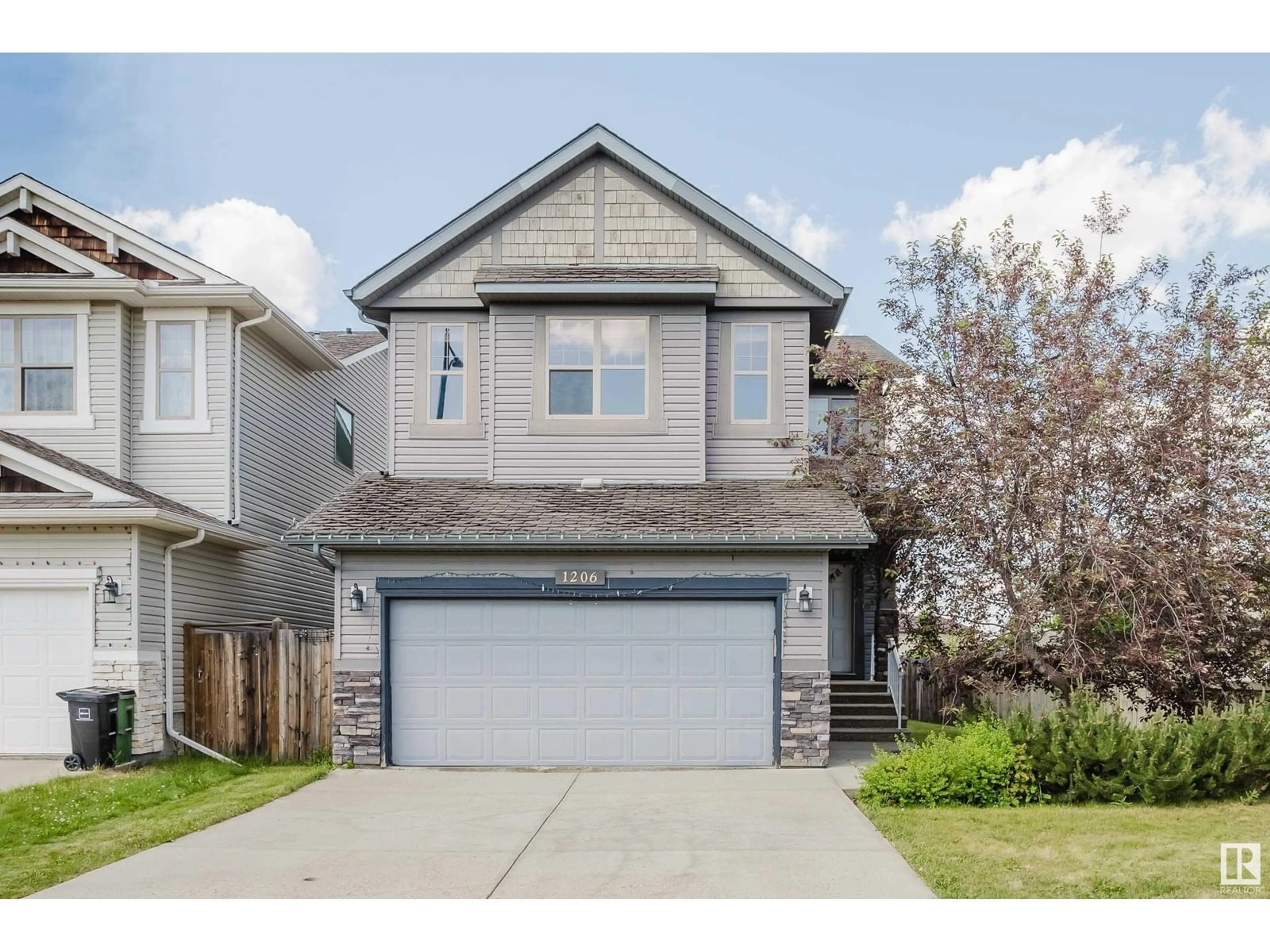 Home with vinyl exterior material, street for 1206 37 AV, Edmonton Alberta T6T0J5