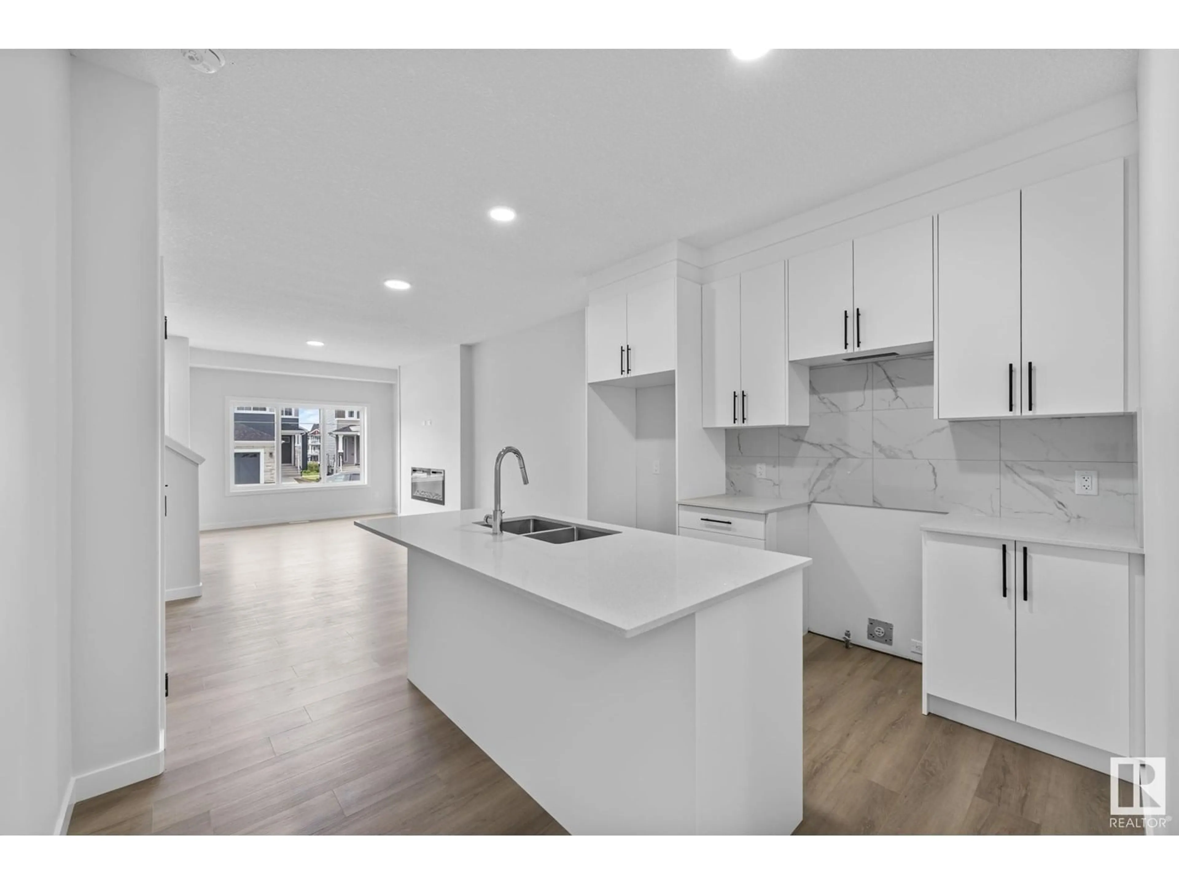 Open concept kitchen, ceramic/tile floor for 16521 20 AV SW, Edmonton Alberta T6W5K1