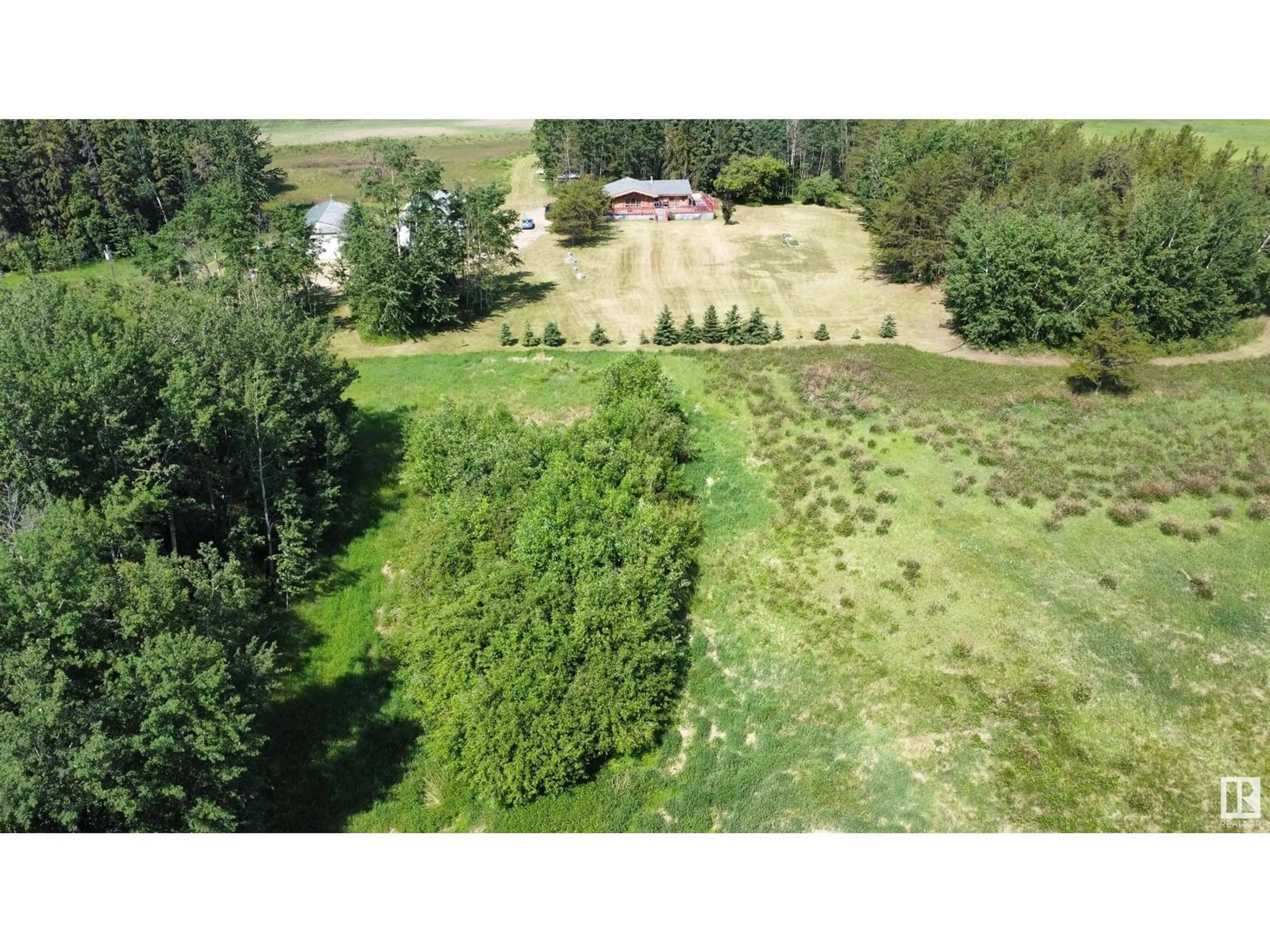 A pic from outside/outdoor area/front of a property/back of a property/a pic from drone, forest/trees view for 63118 263, Rural Westlock County Alberta T0G0S0