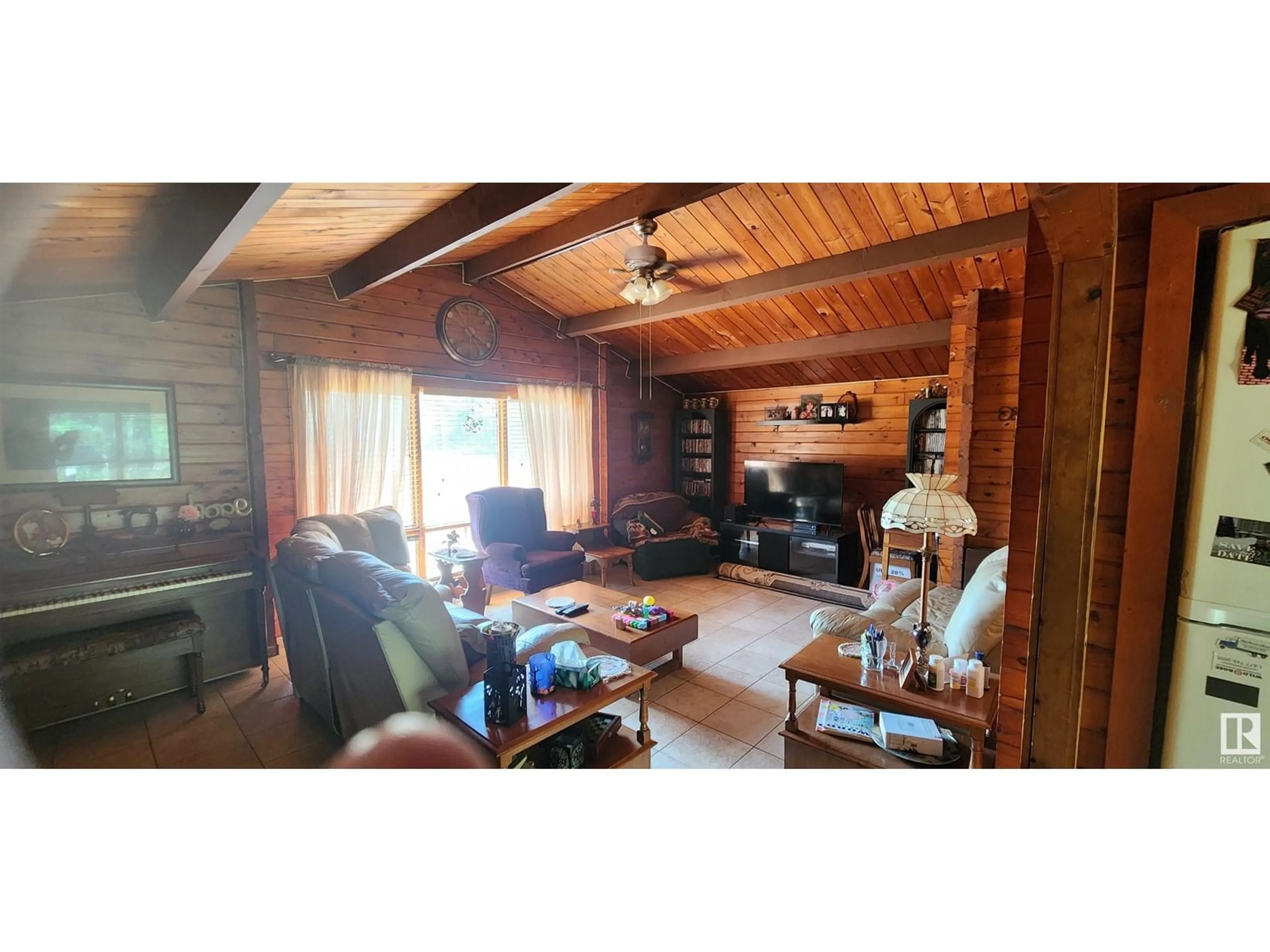 Living room with furniture, wood/laminate floor for 63118 263, Rural Westlock County Alberta T0G0S0