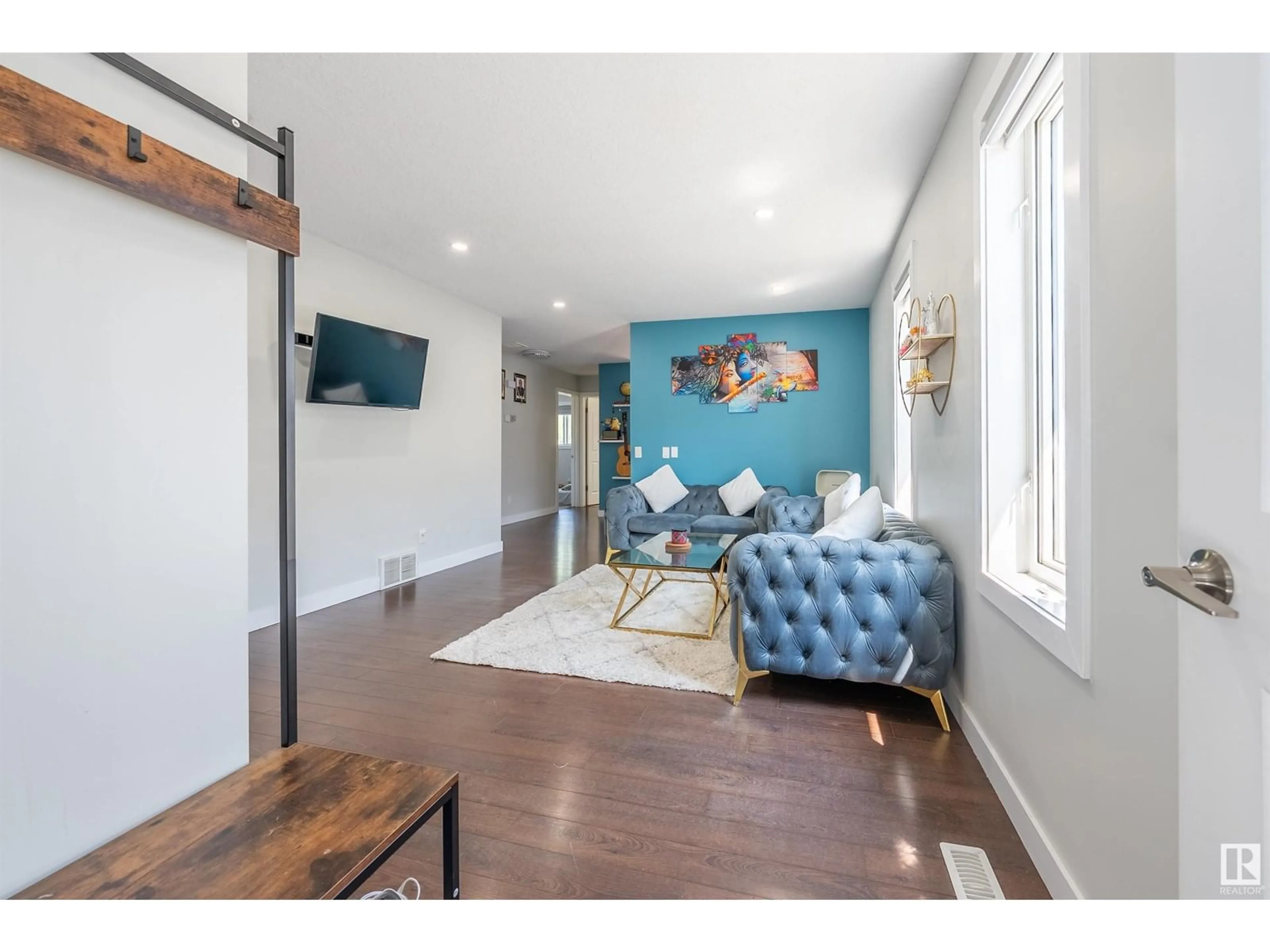Living room with furniture, wood/laminate floor for 3312 27 AVE, Edmonton Alberta T6T1P7
