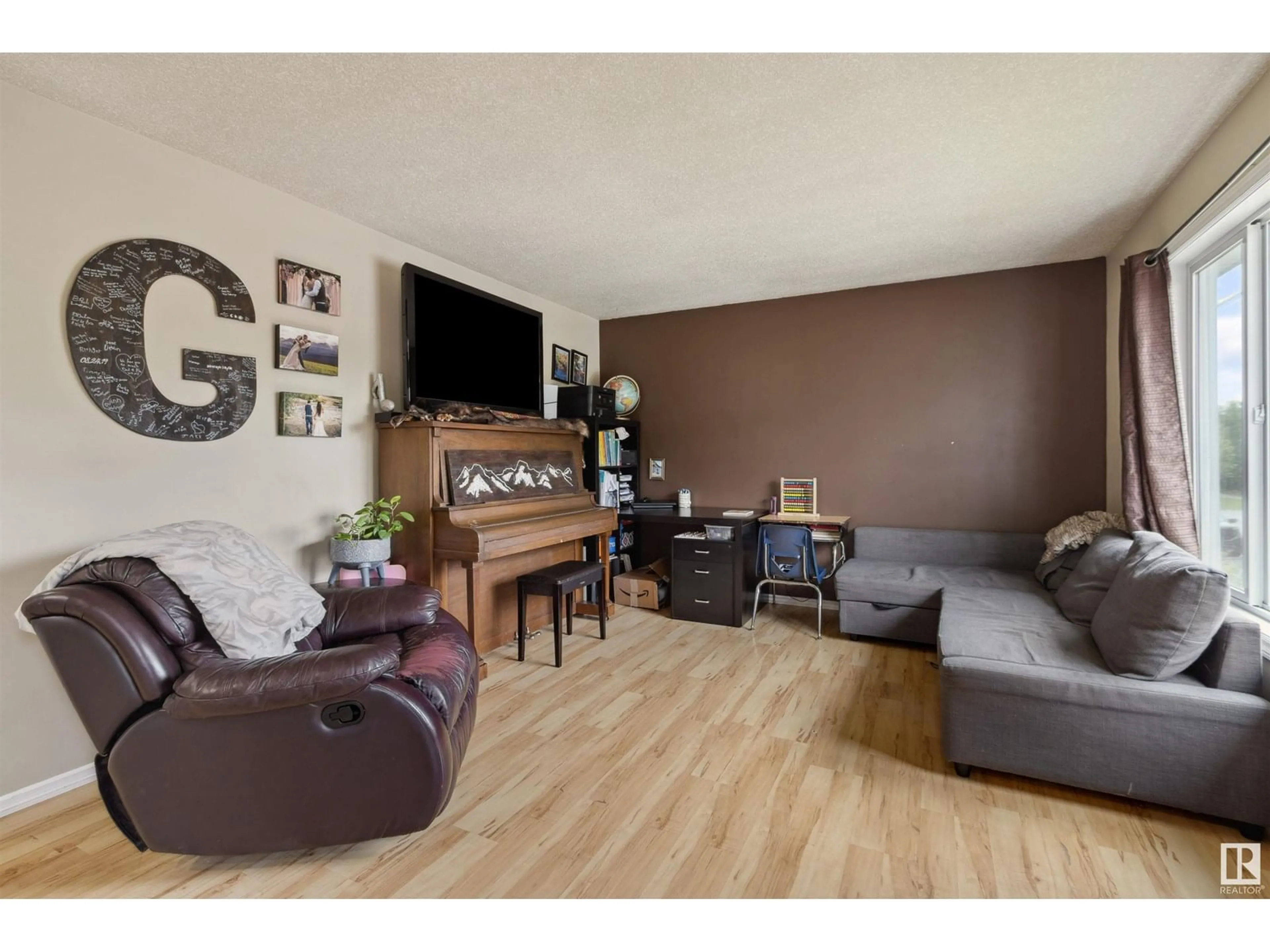 Living room with furniture, wood/laminate floor for 5044 43 STREET, Drayton Valley Alberta T7A1B8