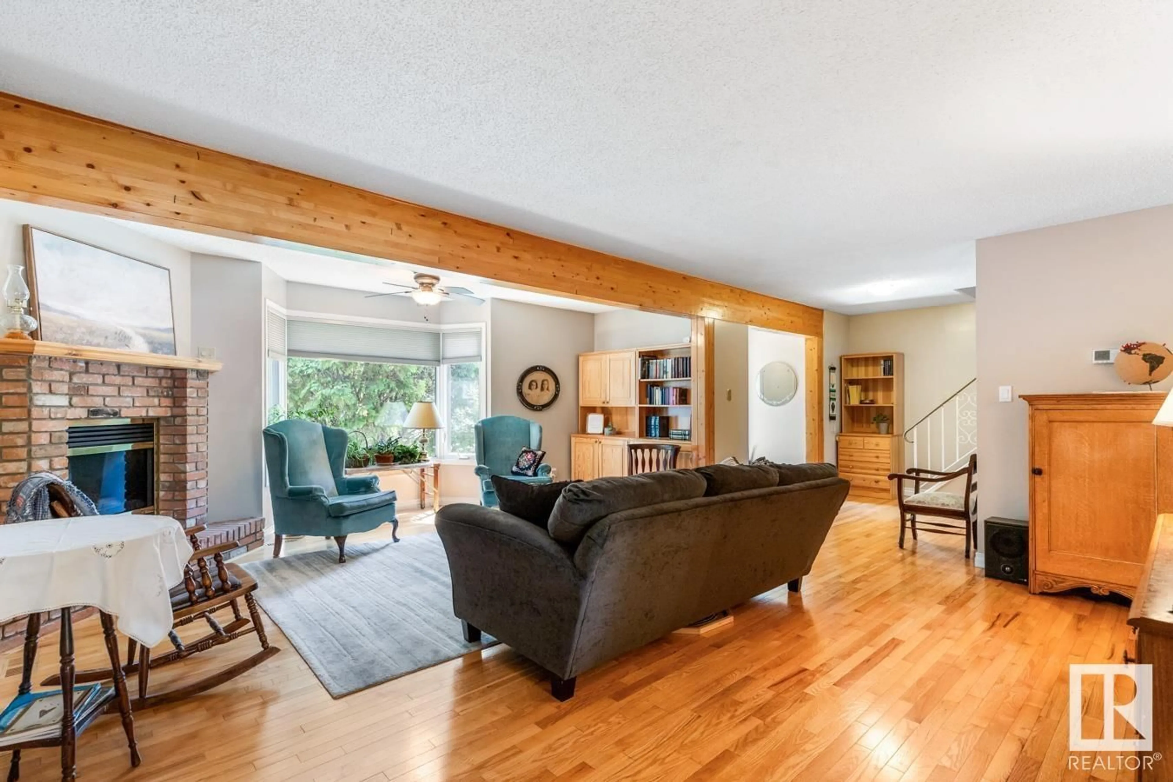 Living room with furniture, wood/laminate floor for 9 MARKET ST, Sherwood Park Alberta T8A0T5