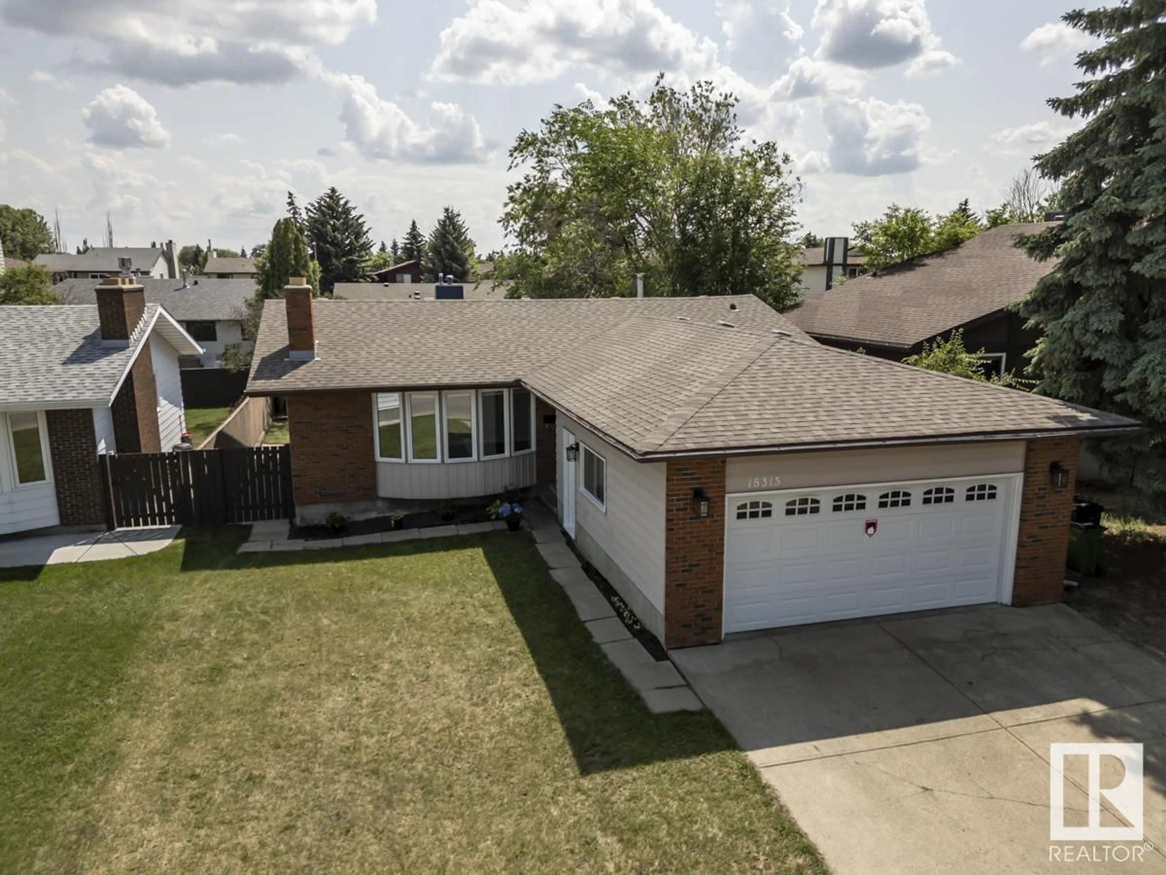 A pic from outside/outdoor area/front of a property/back of a property/a pic from drone, street for 18315 78 AV, Edmonton Alberta T5T2G2