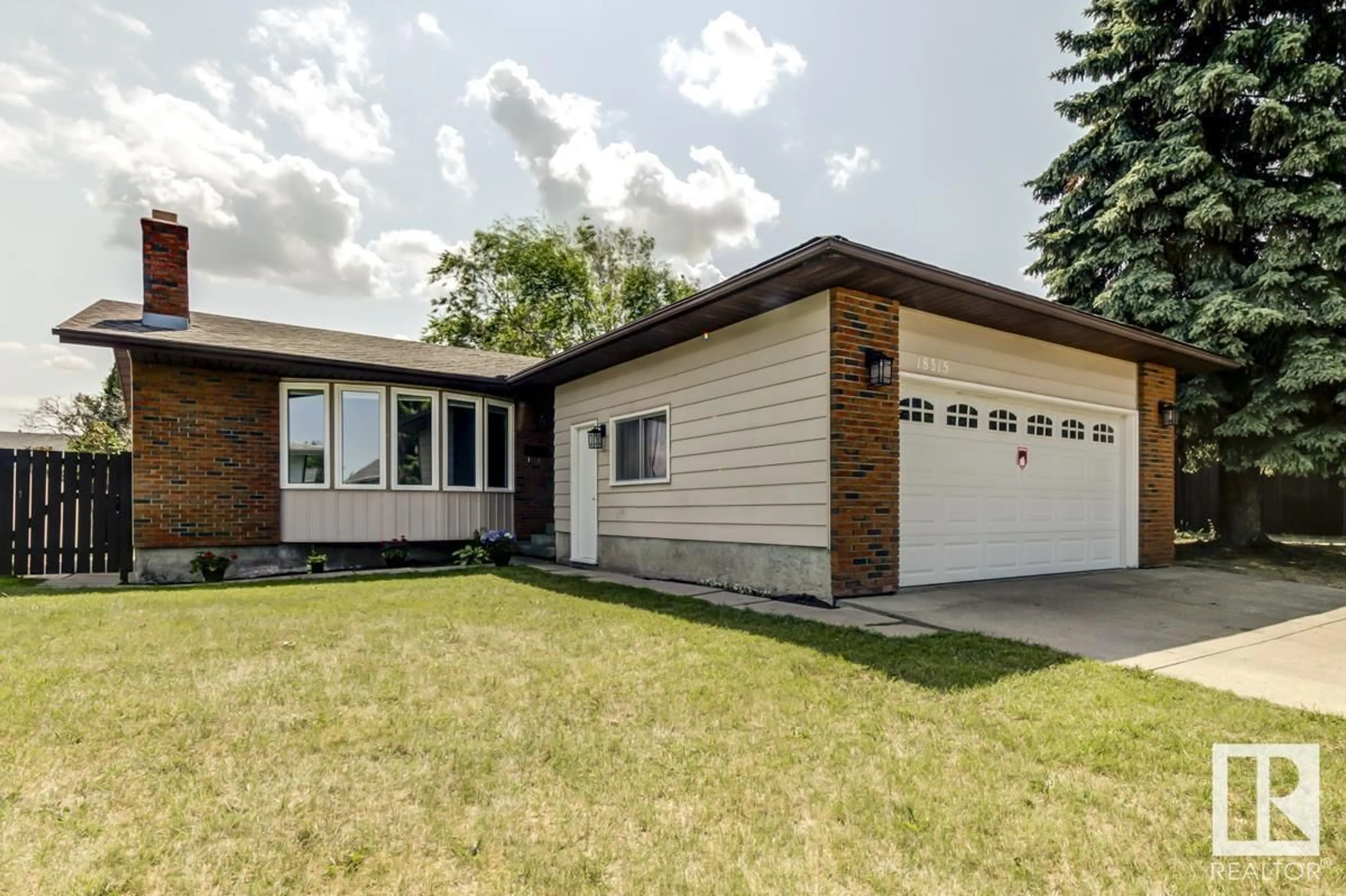 Home with vinyl exterior material, street for 18315 78 AV, Edmonton Alberta T5T2G2