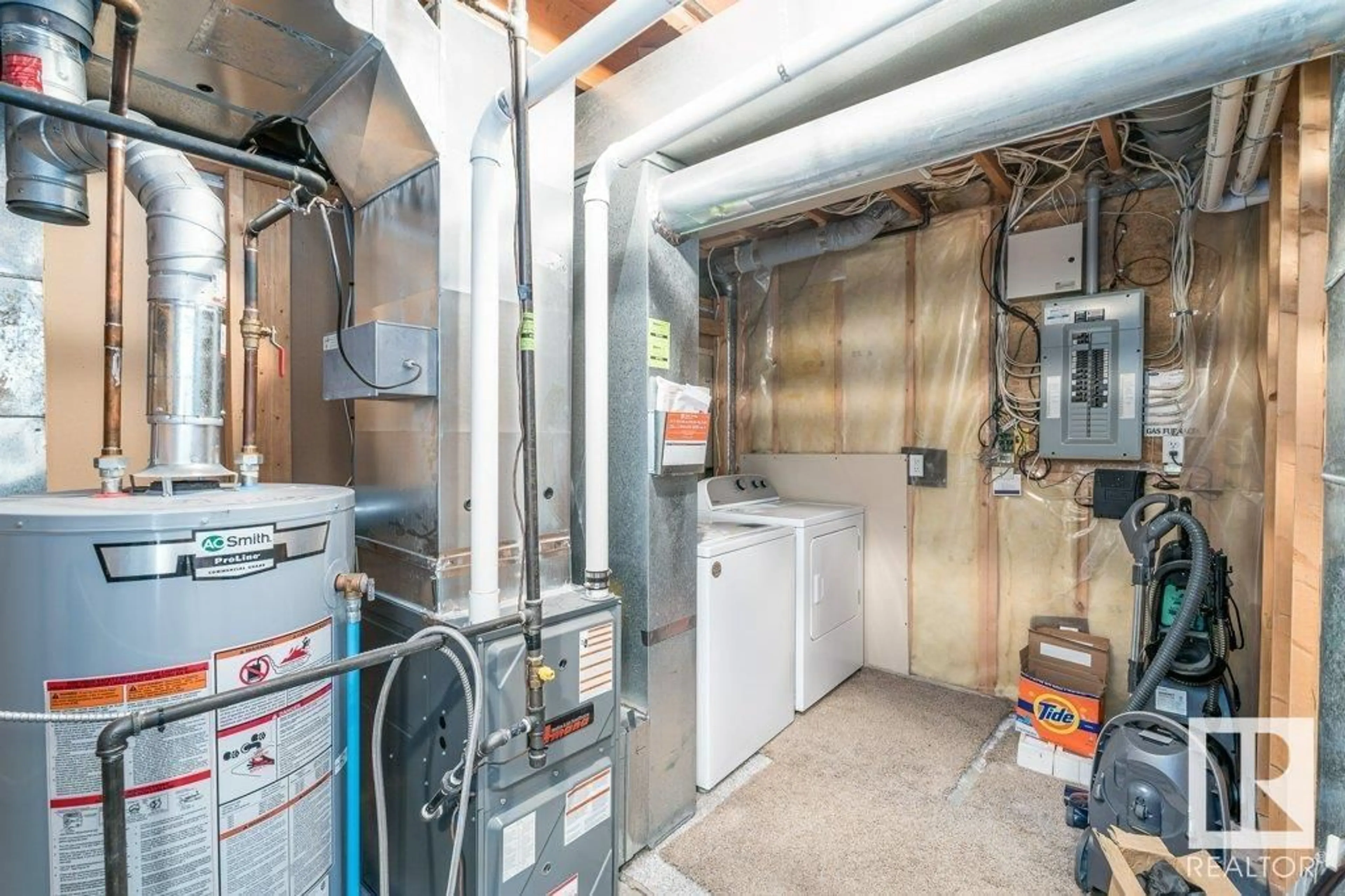 Kitchen with laundary machines, cement floor for 11839 8 AV, Edmonton Alberta T6J6Z9
