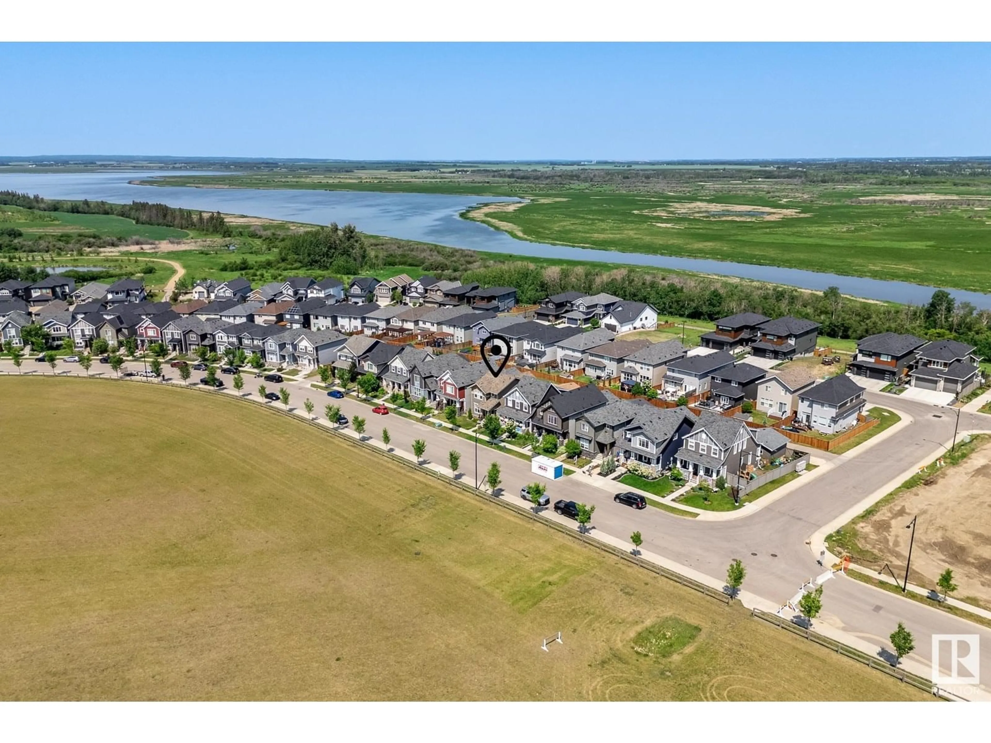 A pic from outside/outdoor area/front of a property/back of a property/a pic from drone, water/lake/river/ocean view for 321 HAWKS RIDGE BV, Edmonton Alberta T5S0M4