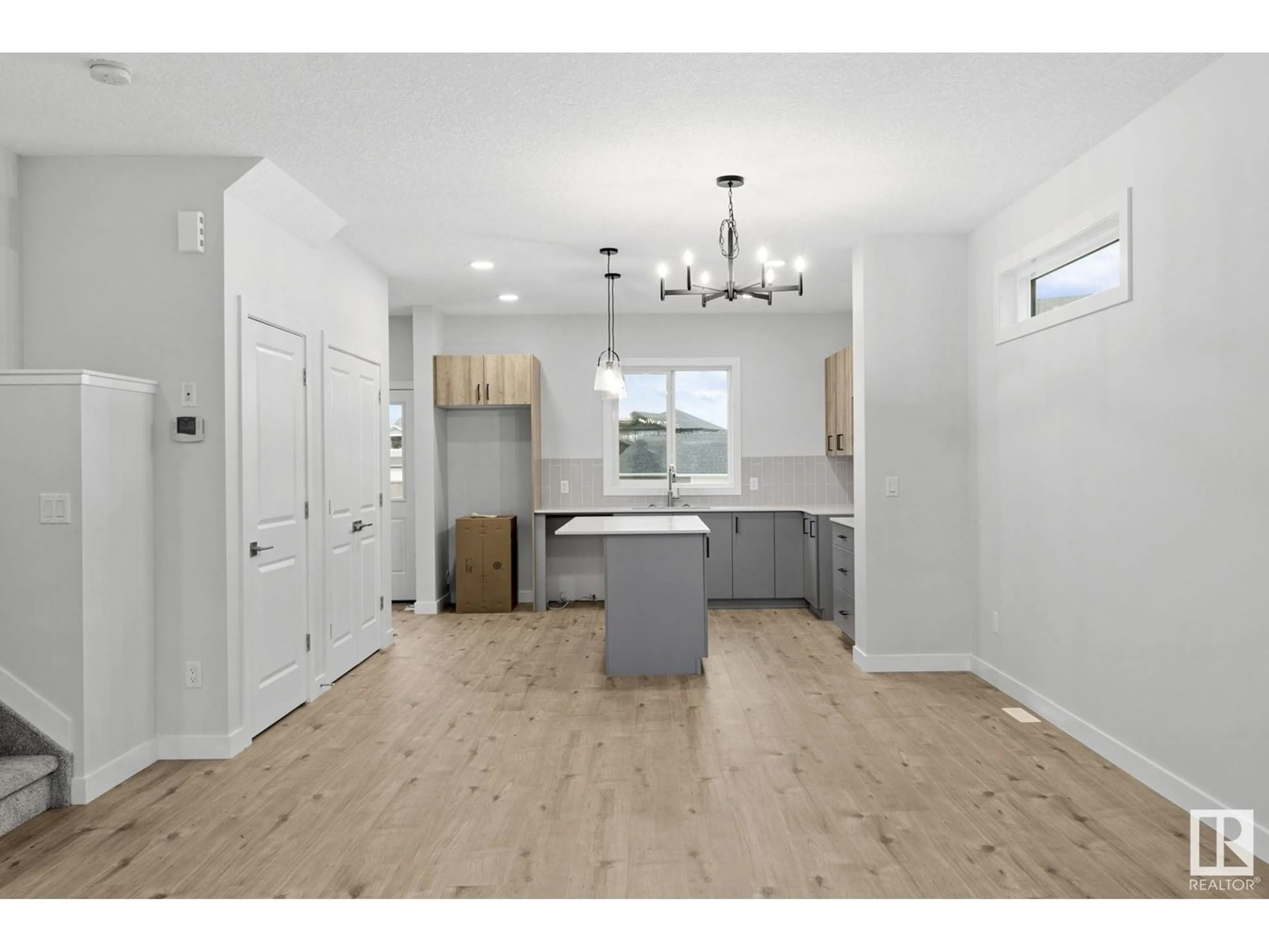 Open concept kitchen, wood/laminate floor for 21 ETON LI, Spruce Grove Alberta T7X4B7