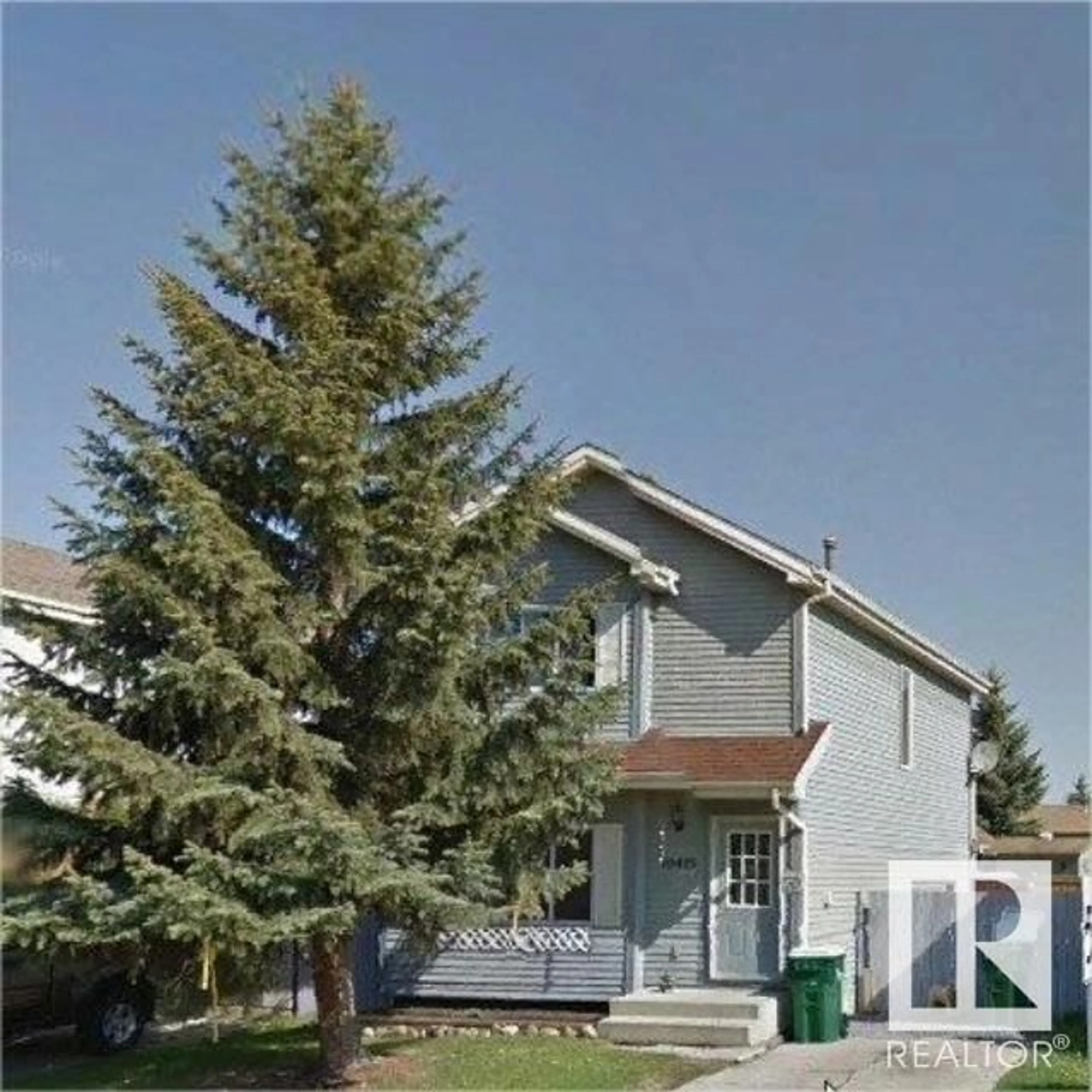 Home with vinyl exterior material, street for 10410 97 AV, Morinville Alberta T8R1E1