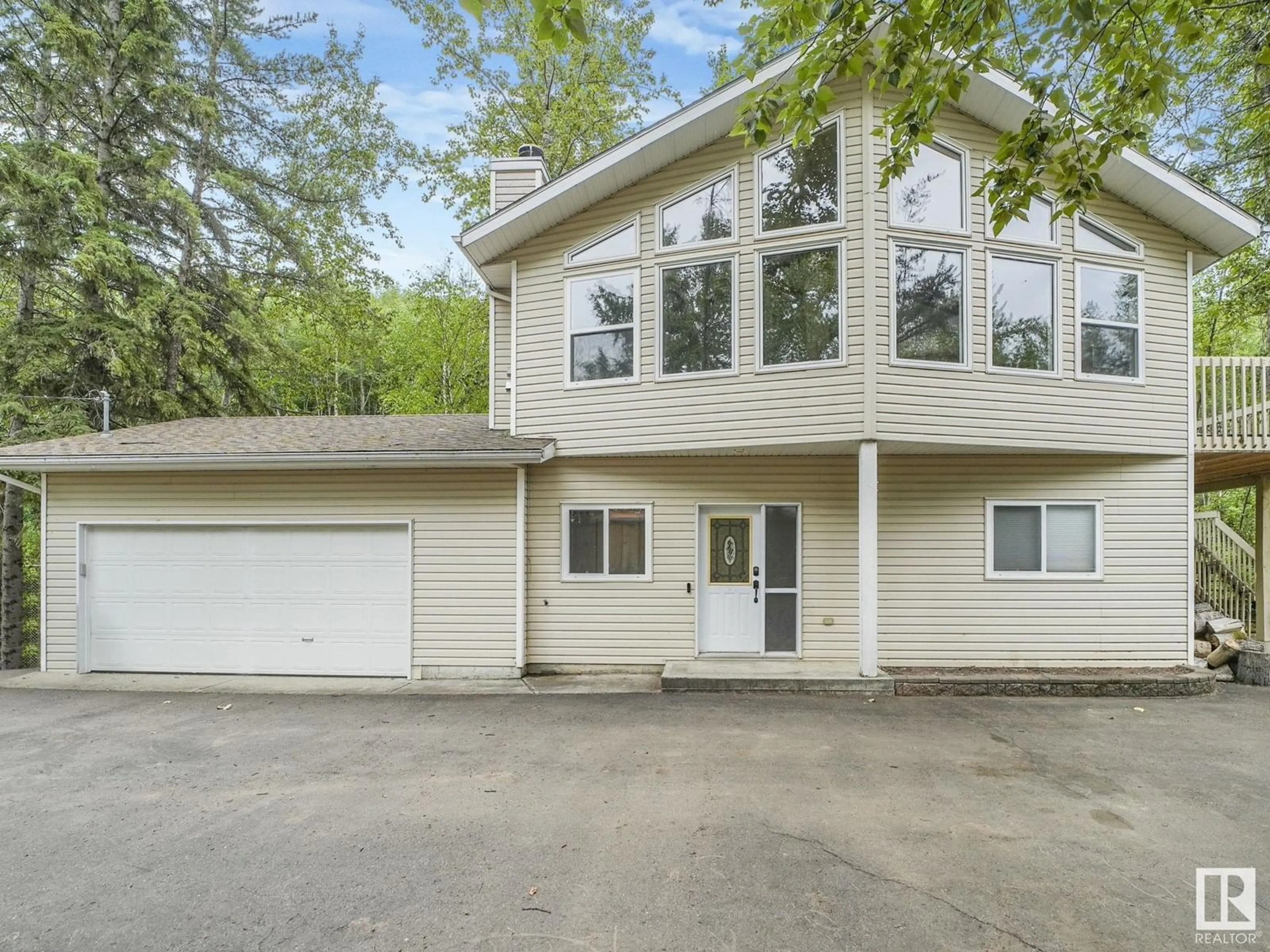 Home with vinyl exterior material, street for 615 ASH ST, Rural Sturgeon County Alberta T0G0J0