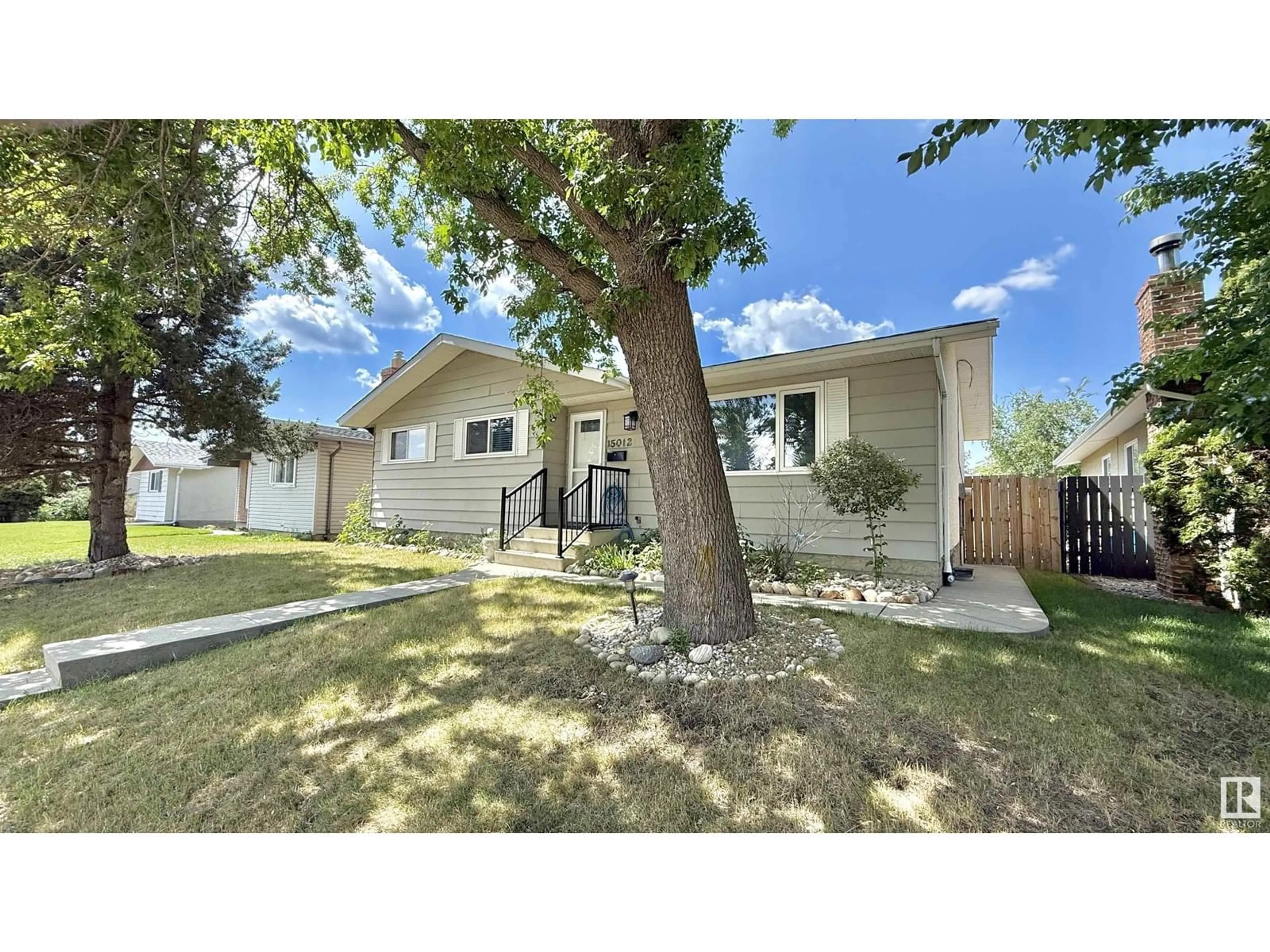 Home with vinyl exterior material, street for 15012 58 ST, Edmonton Alberta T5A2M2