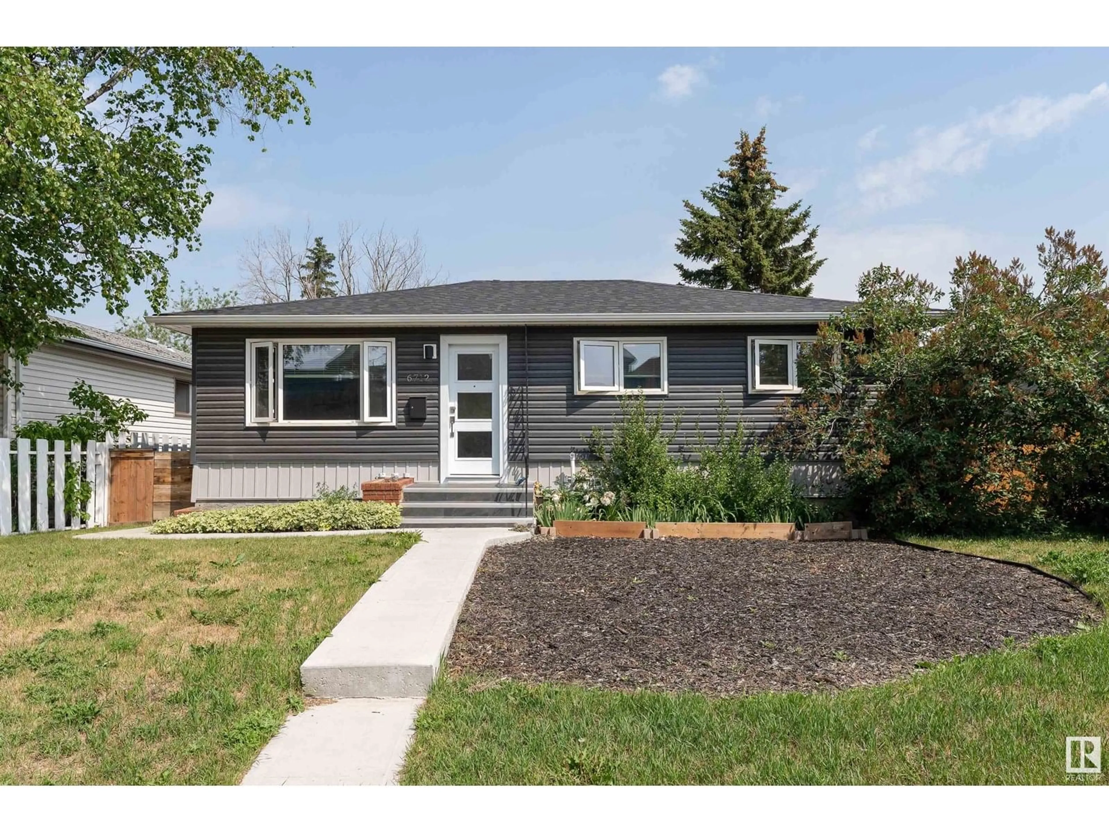 Home with vinyl exterior material, street for 6712 86 AV, Edmonton Alberta T6B2G6