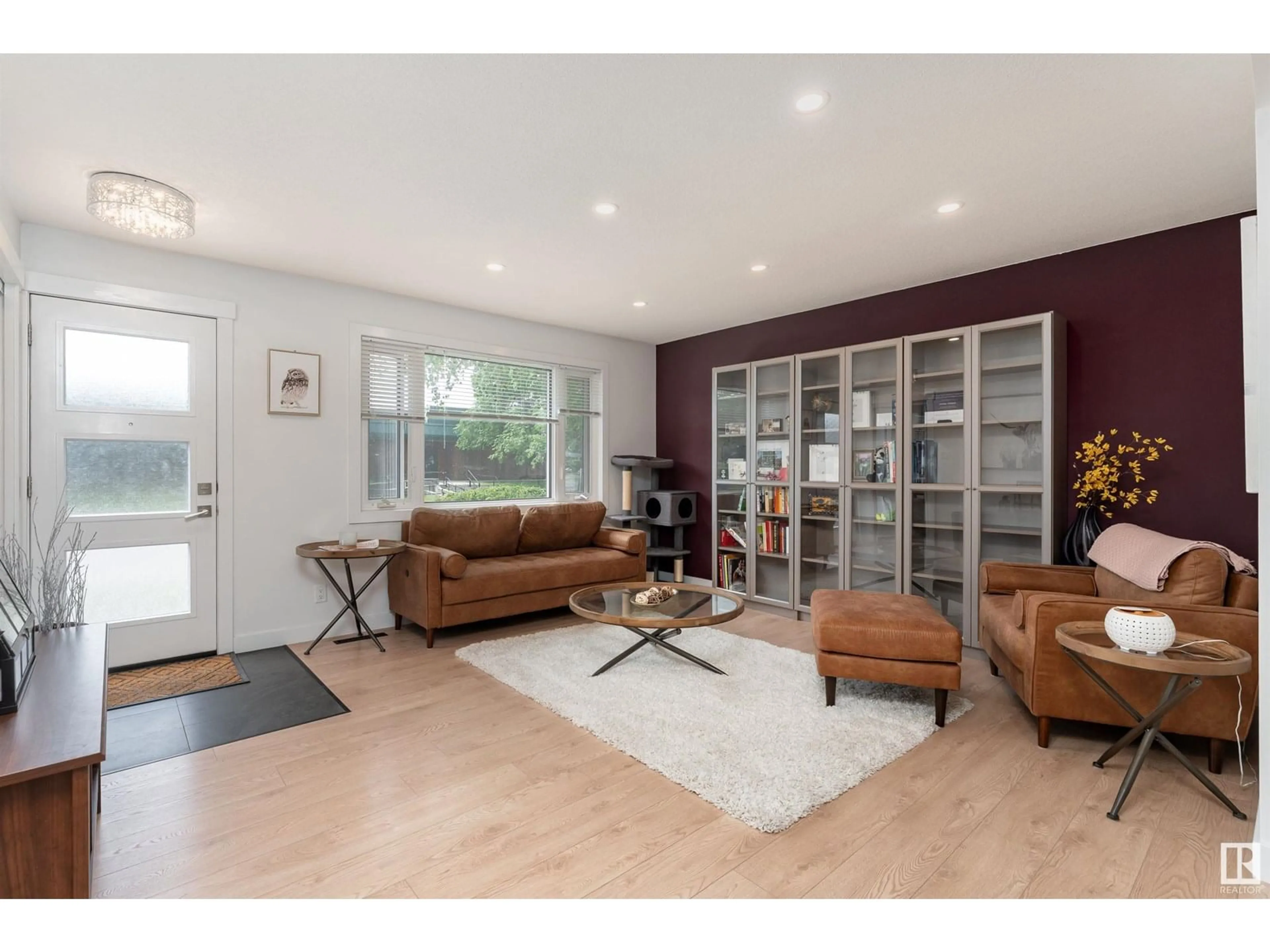 Living room with furniture, wood/laminate floor for 6712 86 AV, Edmonton Alberta T6B2G6